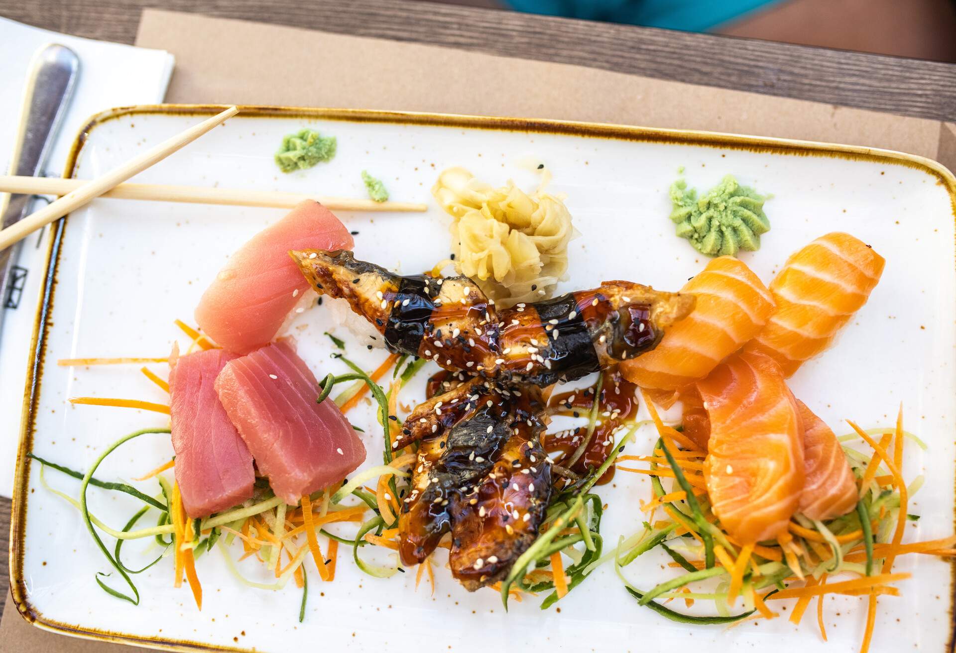 Delicious sushi on plate Sashimi, nigiri, unagi sushi, tuna, salmon, wasabi