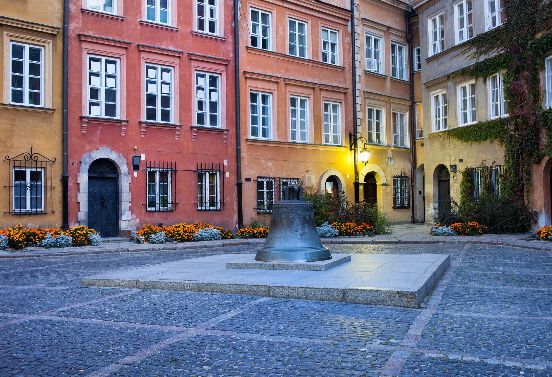 Bronze bell on Kanonia Square in Old Town of Warsaw, Poland, early morning.