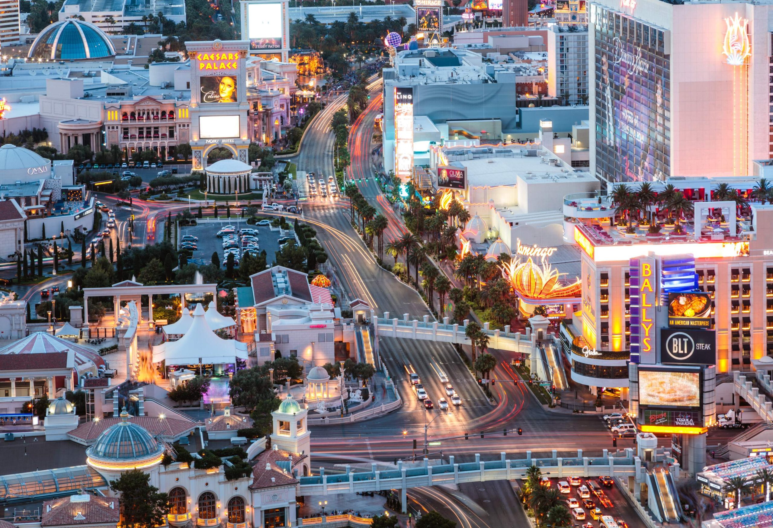 The lively landscape of The Strip in Las Vegas dotted with entertainment venues and hotel complexes.