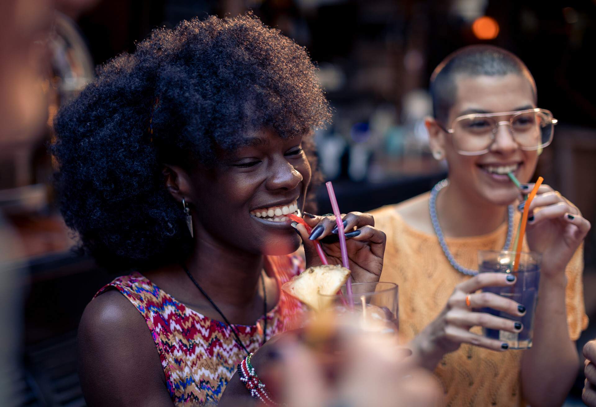 Close up of a group of friends having fun at the bar