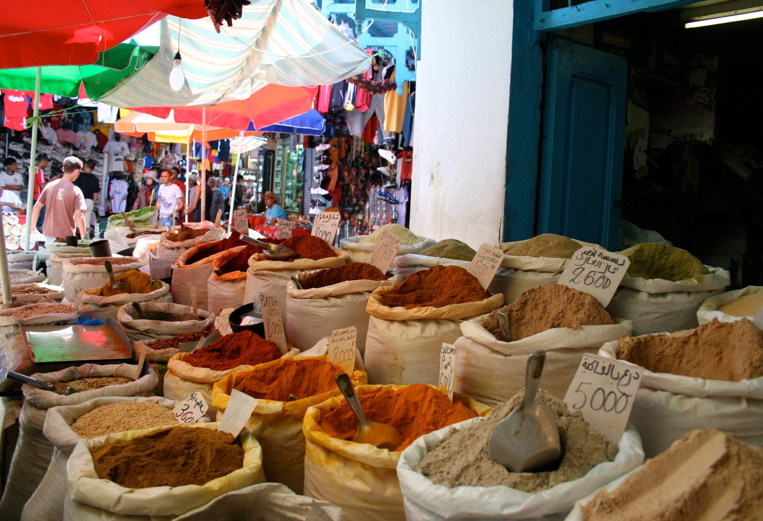 Different spices on sack bags displayed on the market.