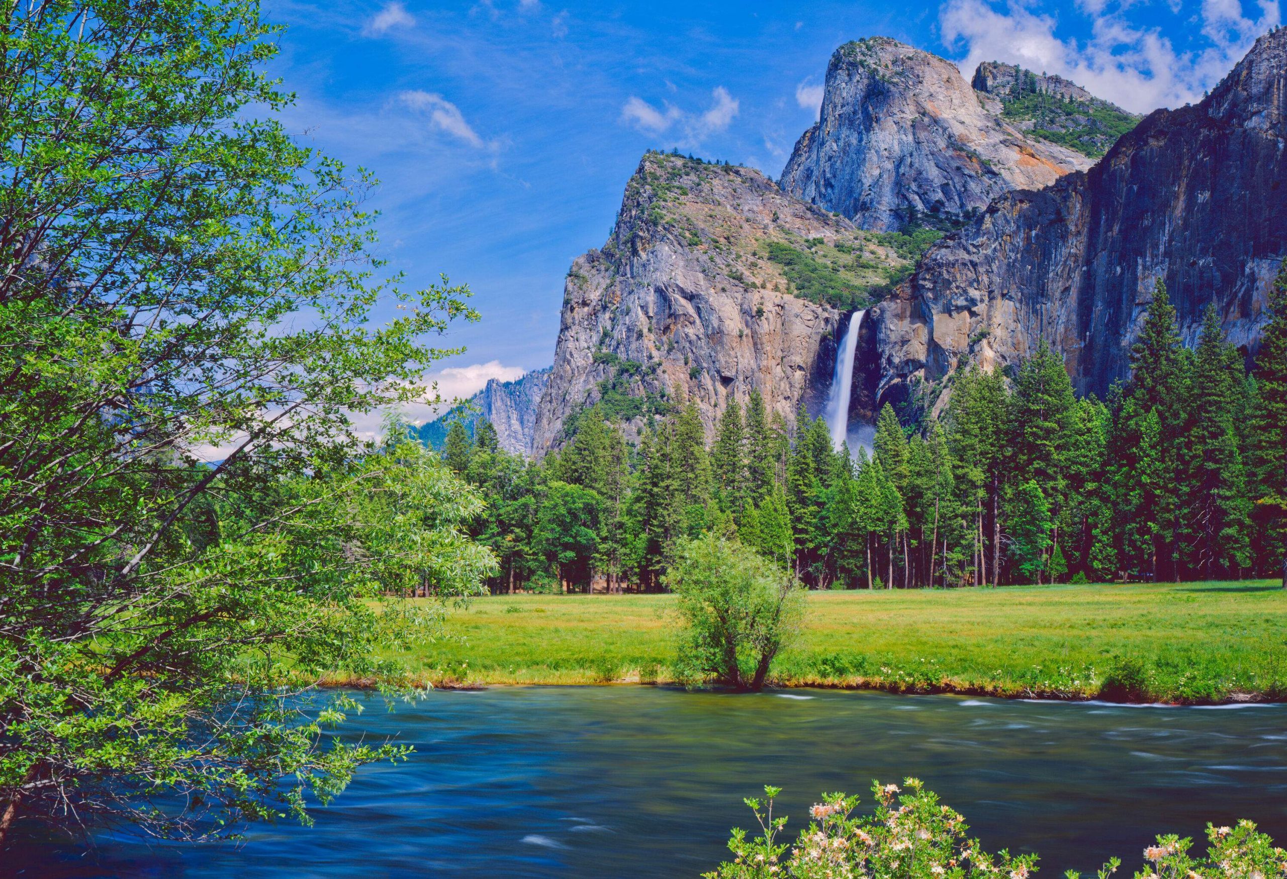 The Lower Yosemite Falls is the final drop on the steep into the lush valley span by a river.