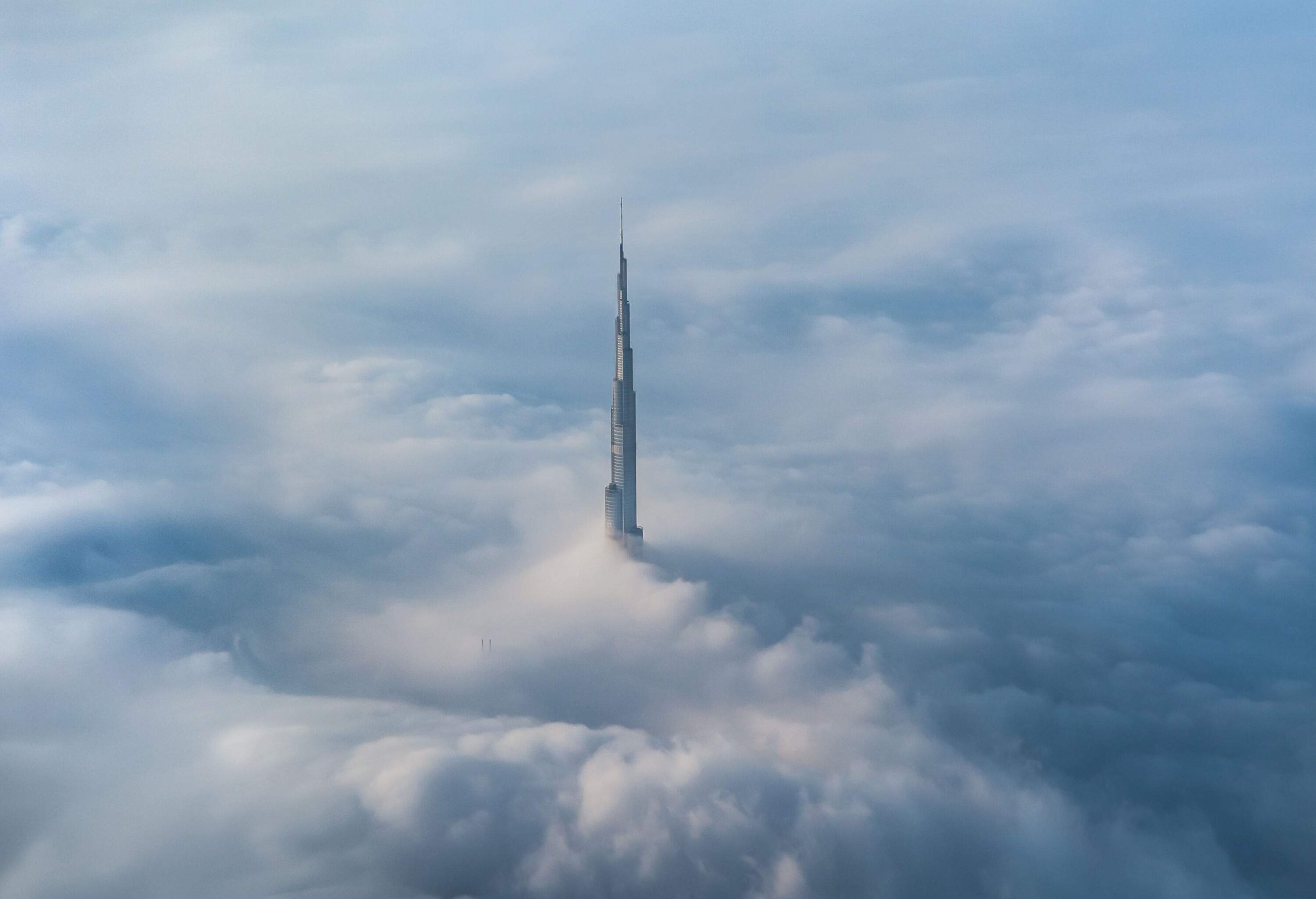 The iconic Burj Khalifa rising through the fog that has engulfed the city.