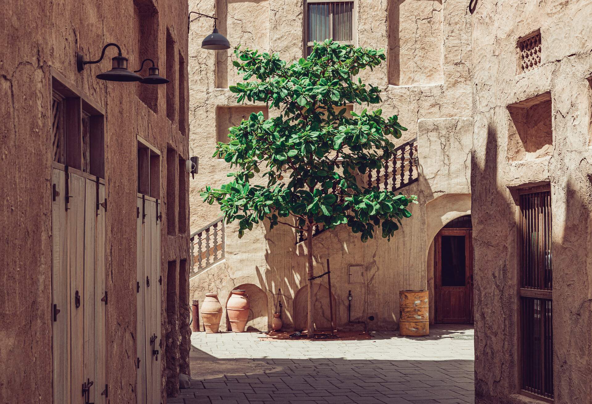 An alley in an old neighbourhood of mud and brick houses.