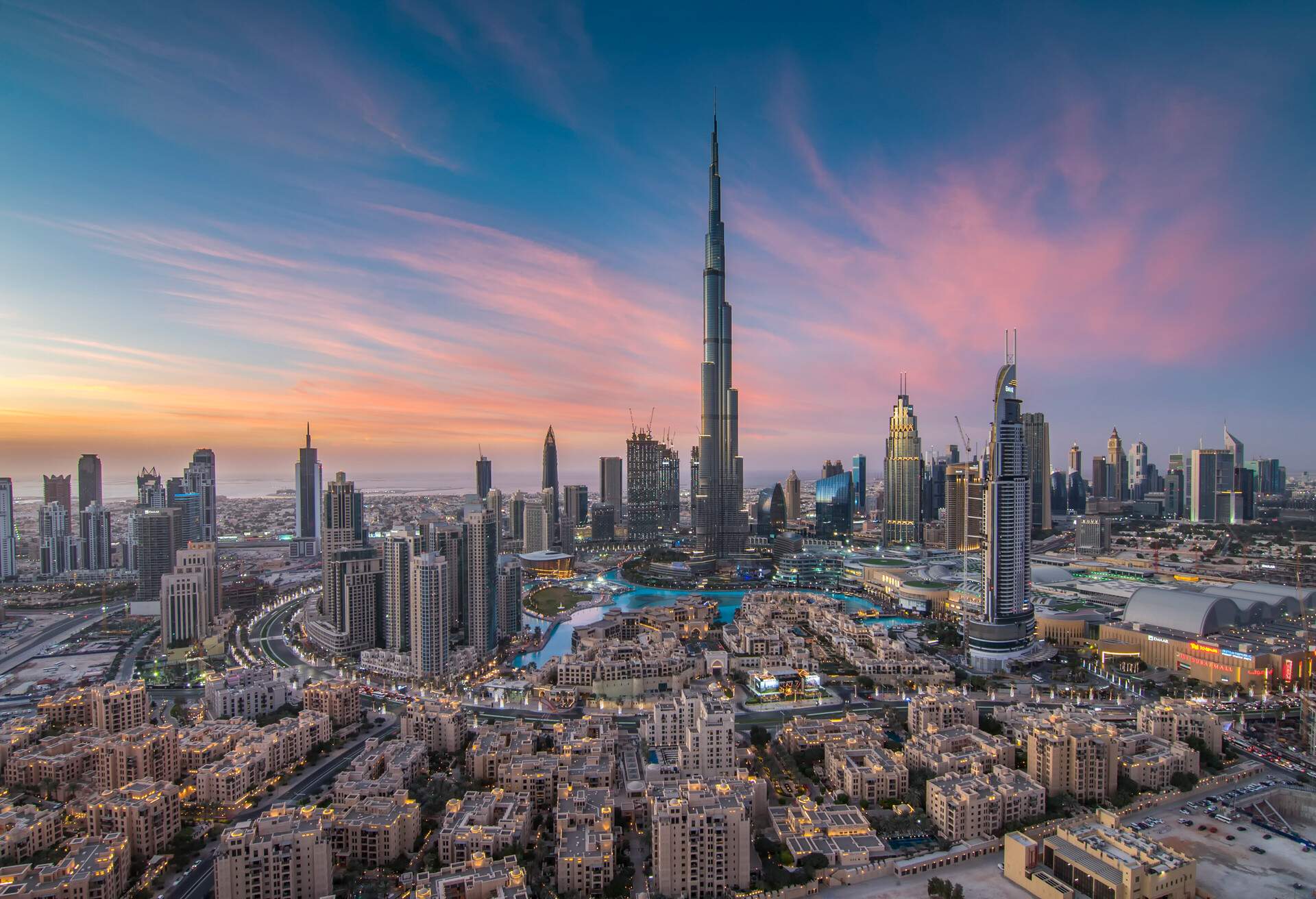 Urban landscape of a city with a cluster of buildings amongst the skyscrapers.