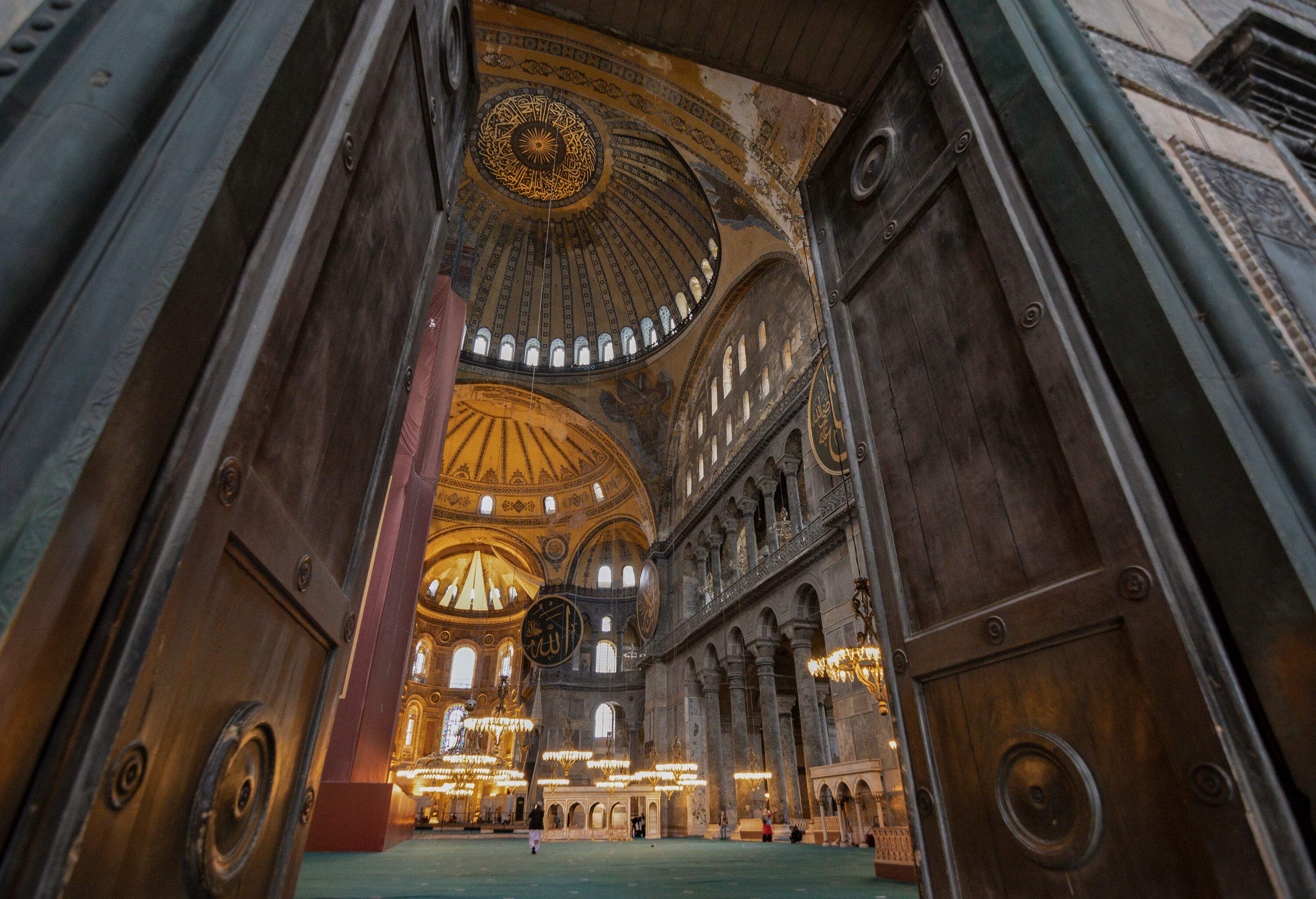 The impressive interior of the Hagia Sophia Grand Mosque as seen from its entry doorway.