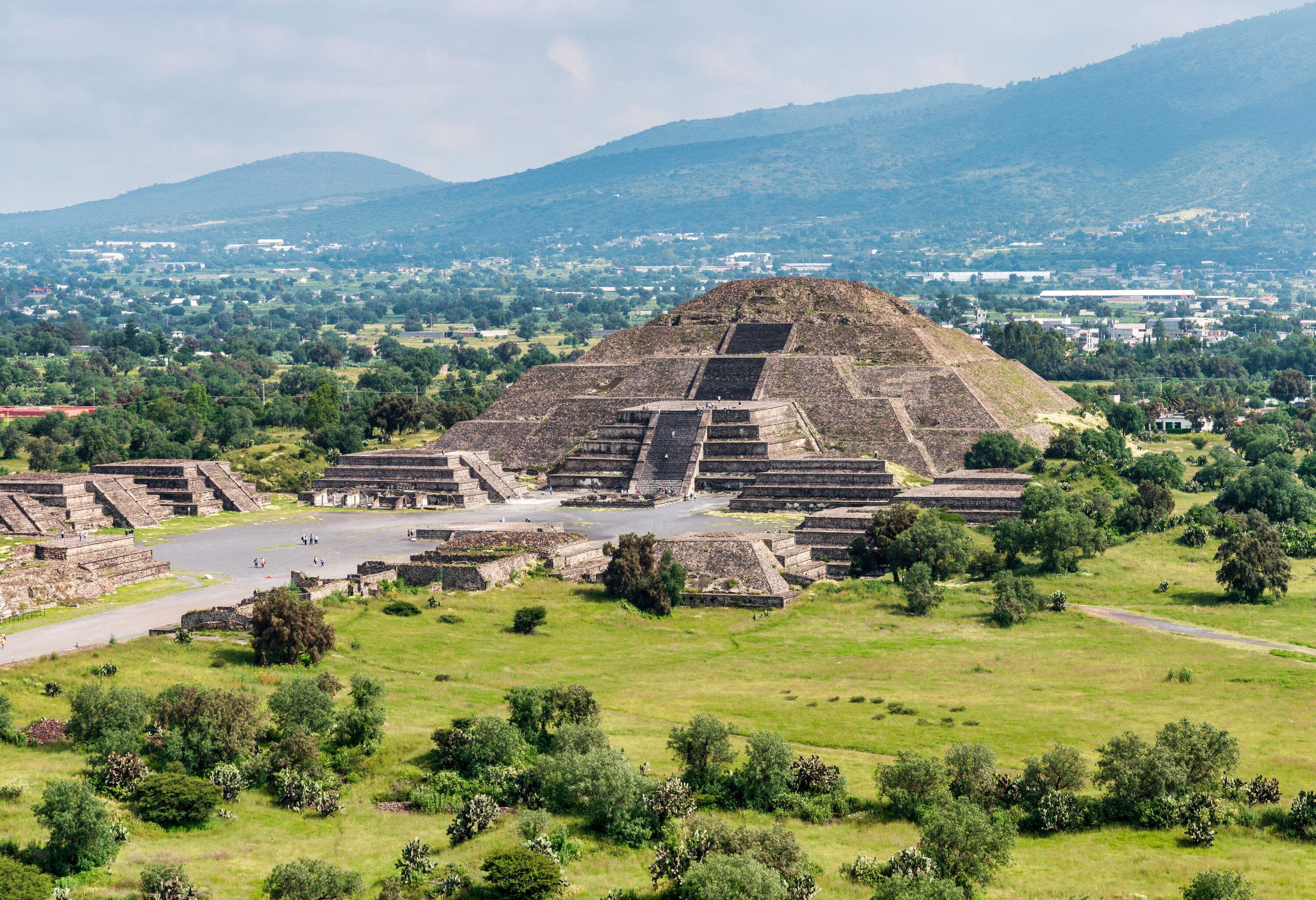 The remarkable architecture of the ancient Teotihuacan pyramids and ruins, featuring intricate carvings and detailed stone masonry.