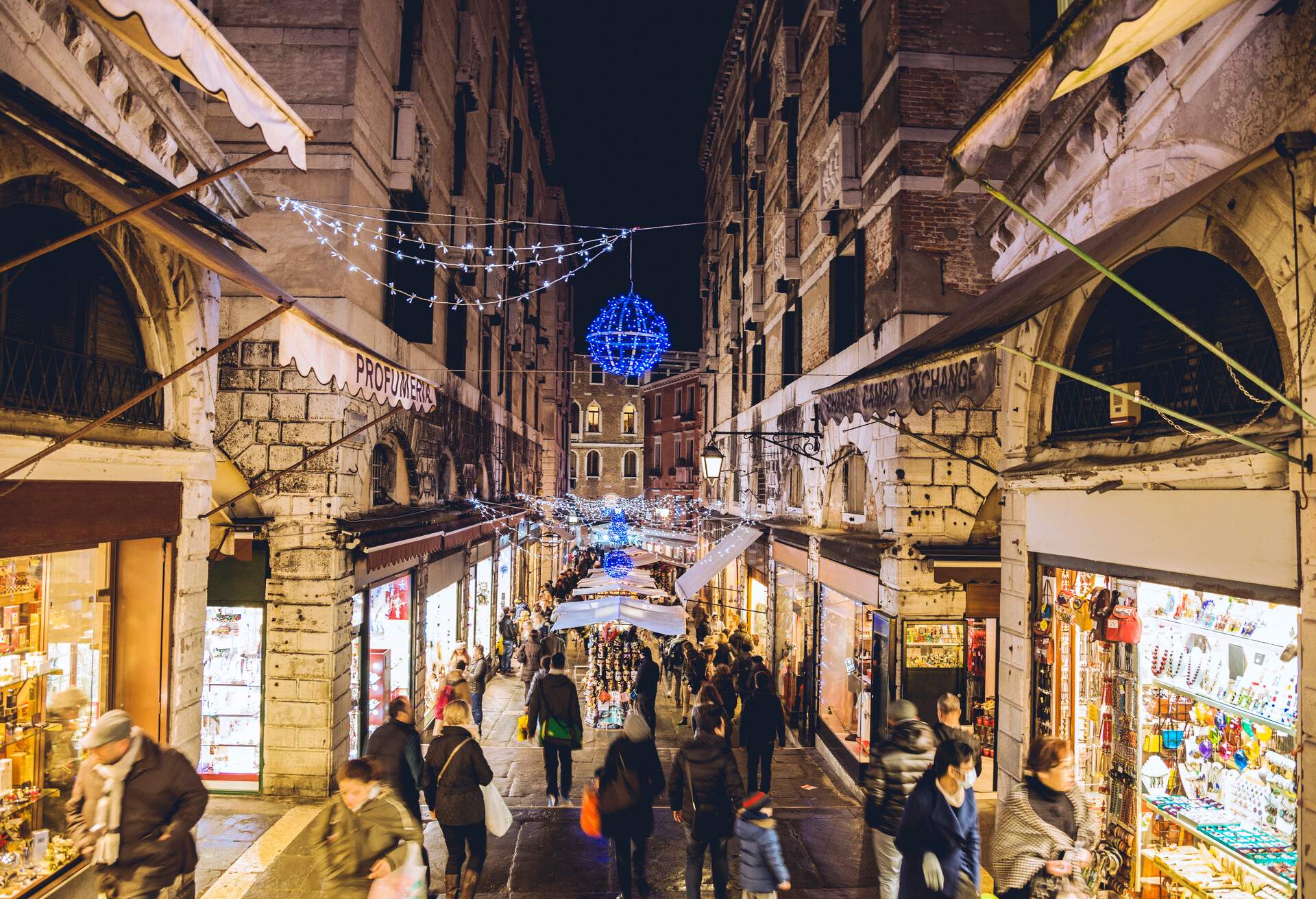 Street view of shops and Christmas lights in Venice, Italy