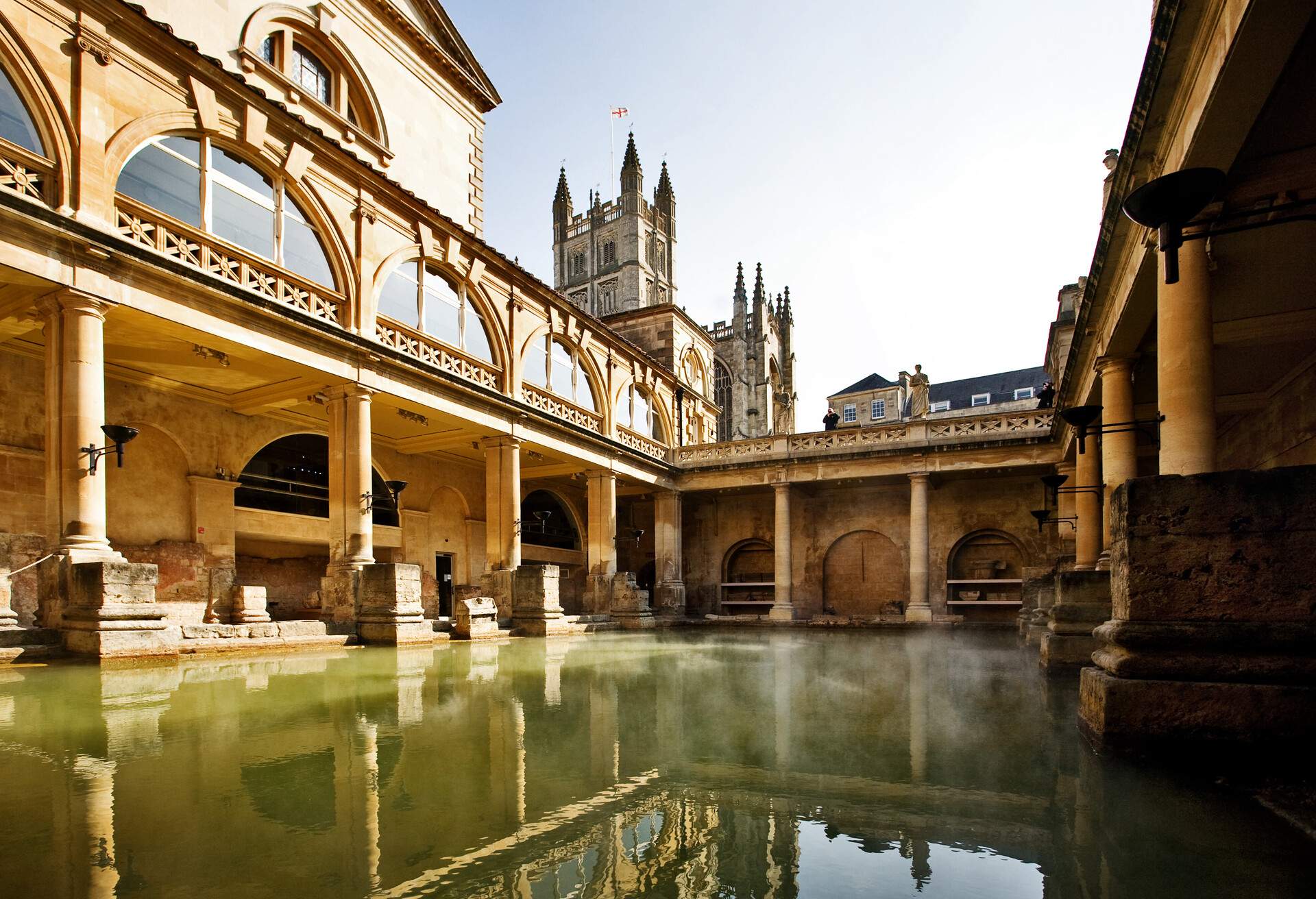 The towers of a medieval church are seen inside a Roman bathhouse.