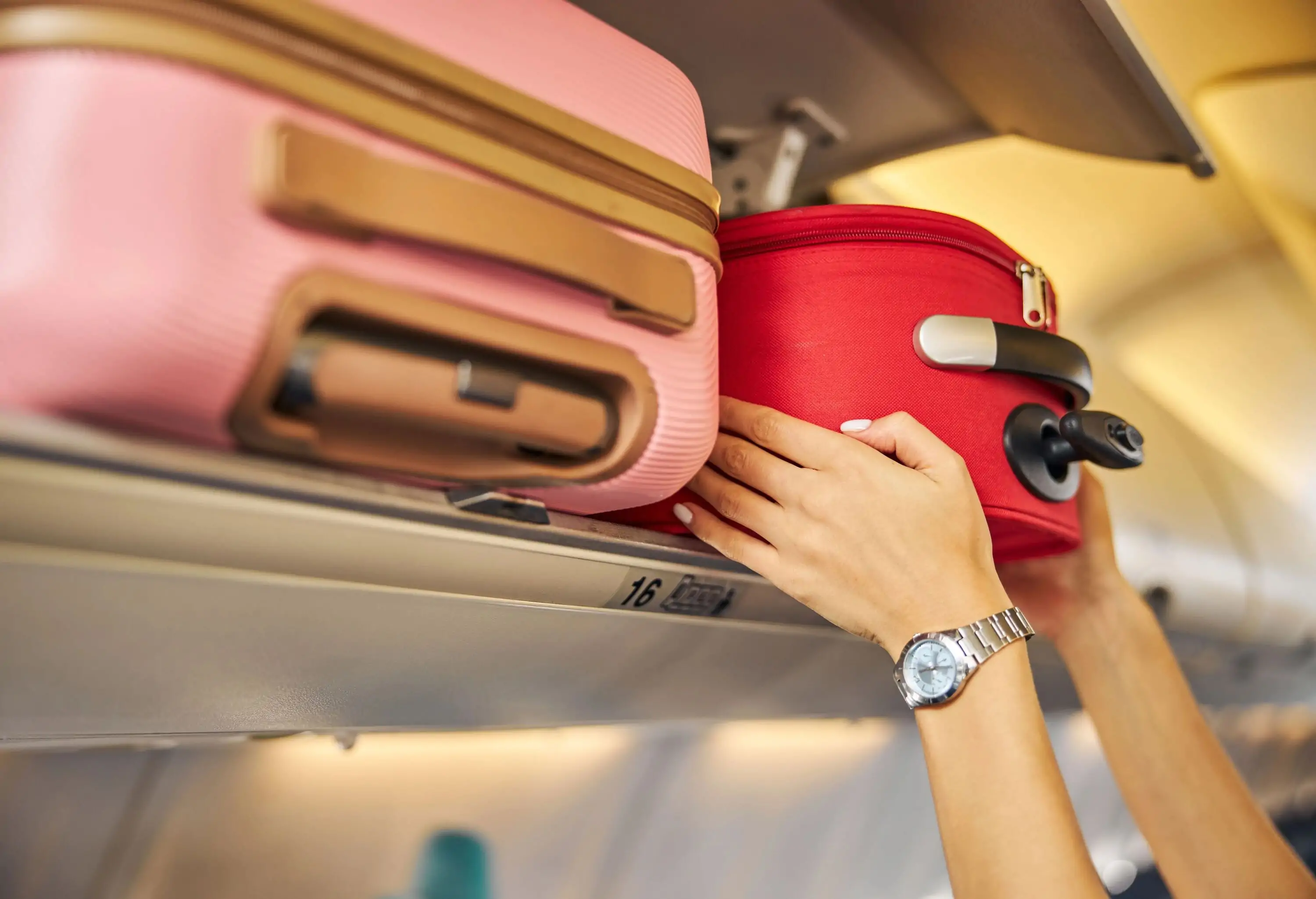 theme_travel_airport_airplane_luggage_carry-on_baggage_person_hands_gettyimages-1281875469