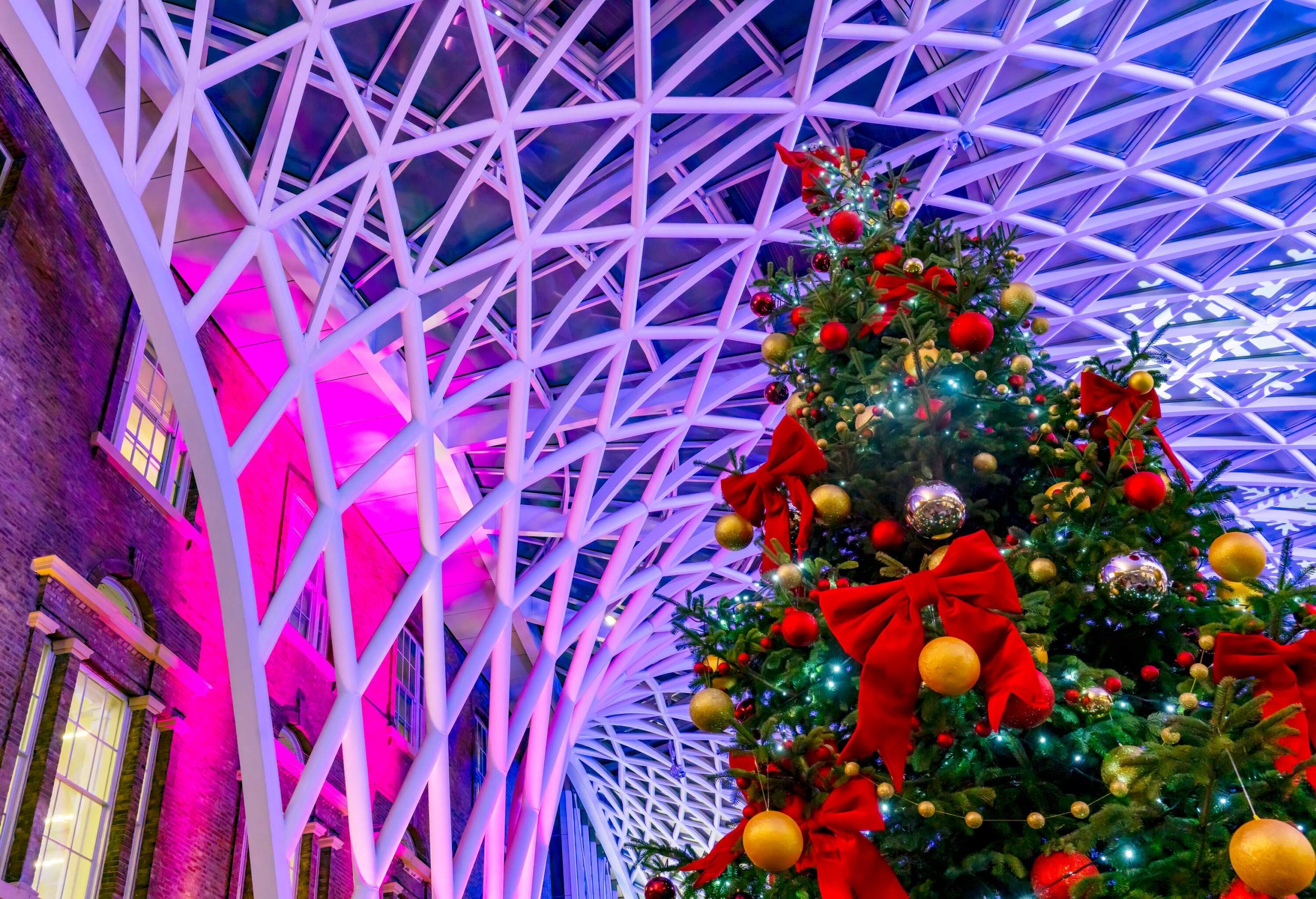 King's Cross station concourse at Christmas 2021. King's Cross is the Main London rail station for the East Coast London to Edinburgh route, it is situated in North East London, near Camden, England, UK.