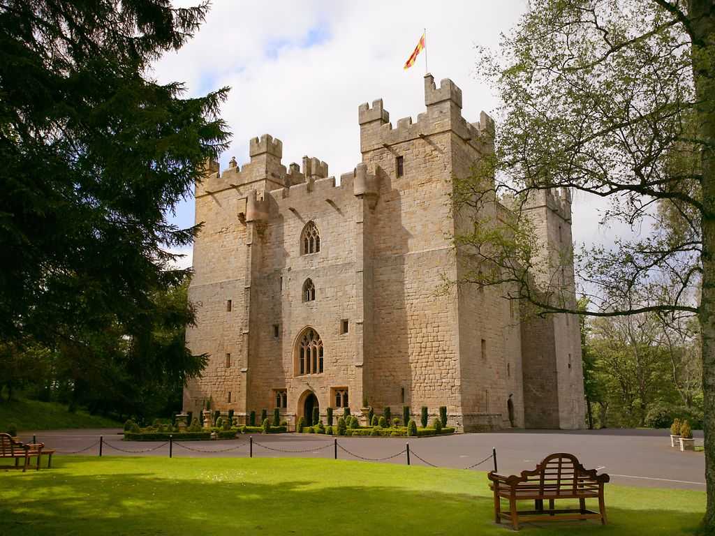 View of an old castle surrounded by trees. Langley-castle-hotel-2