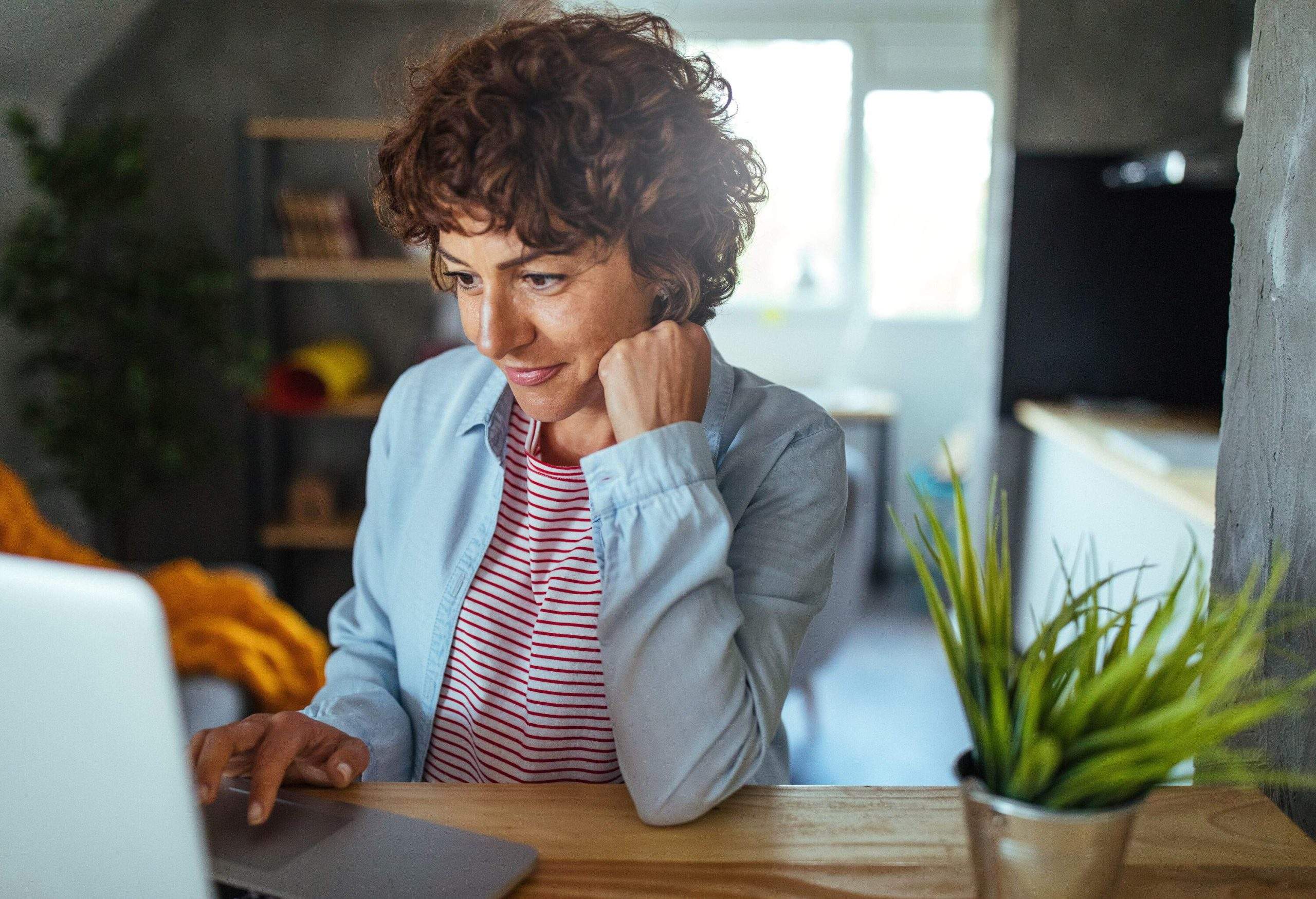 Photo of mature woman working at home