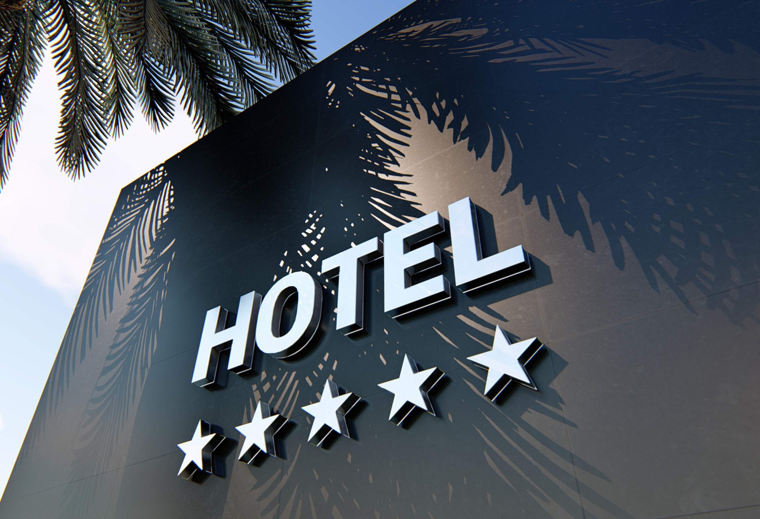 a black building facade with hotel written on it and showing five stars