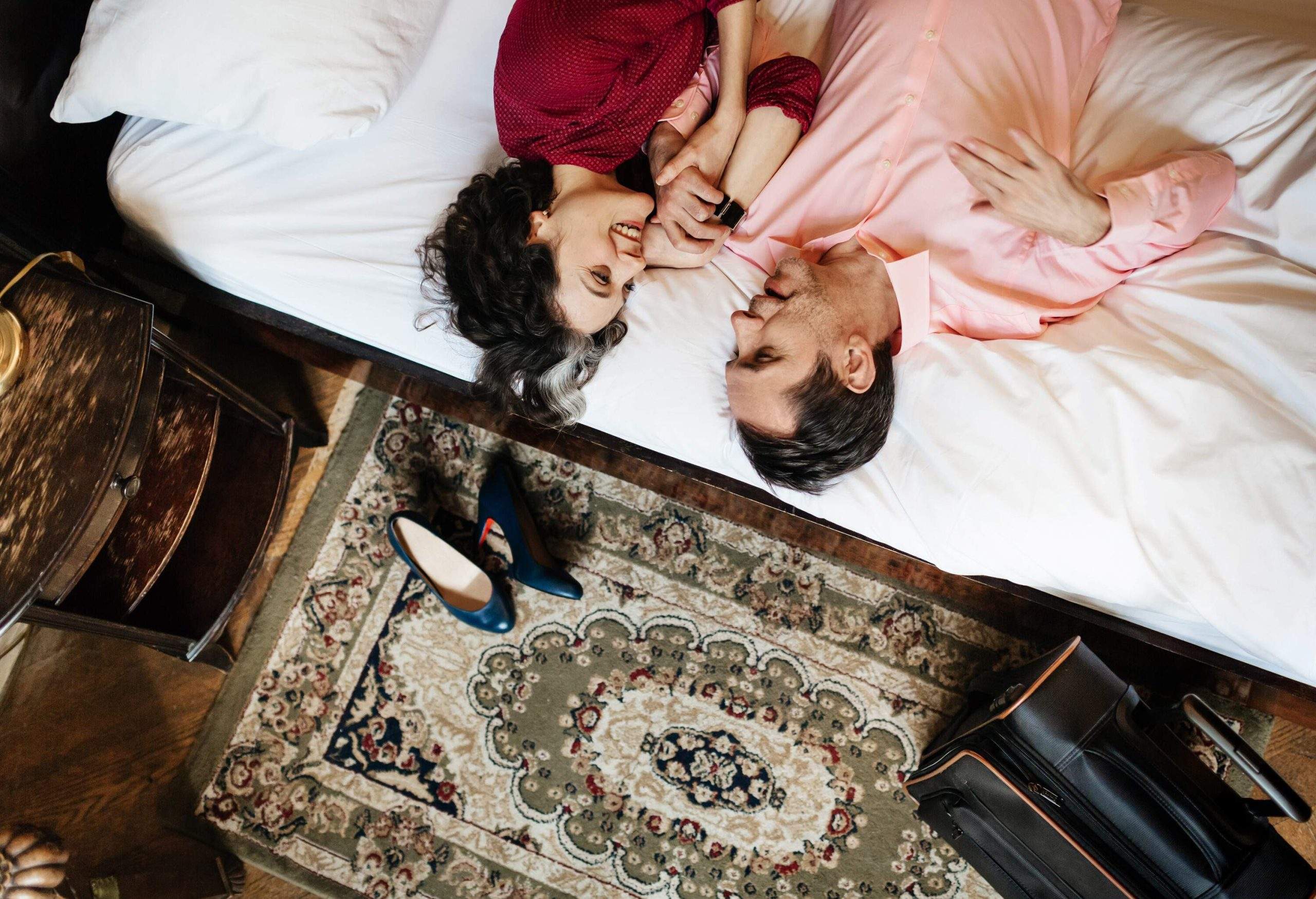 dest_germany_berlin_hotel_room_bed_floor_people_couple_woman_man_gettyimages-634758479-scaled
