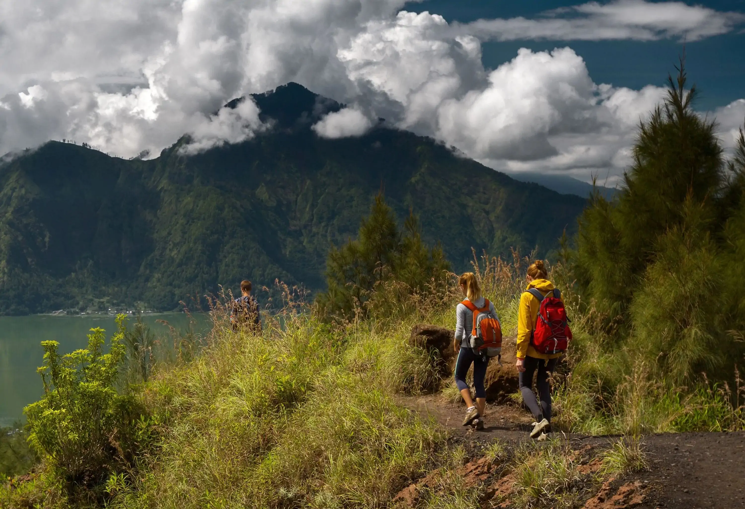 Group of hikers walking in the caldera of volcano of Batur, Bali, Indonesia