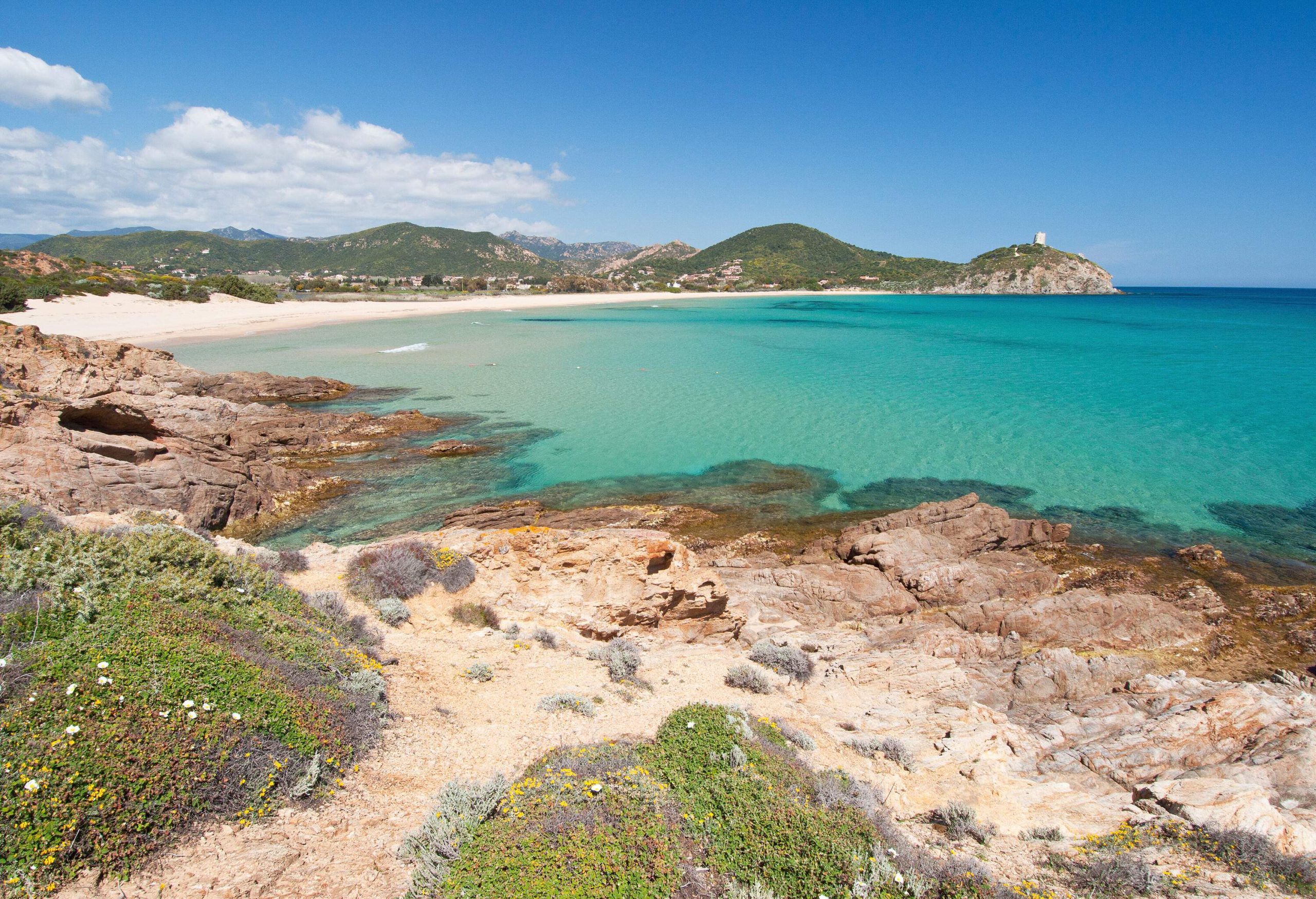 beach with white sand and crystal clear waters in Chia, south Sardinia, Italy