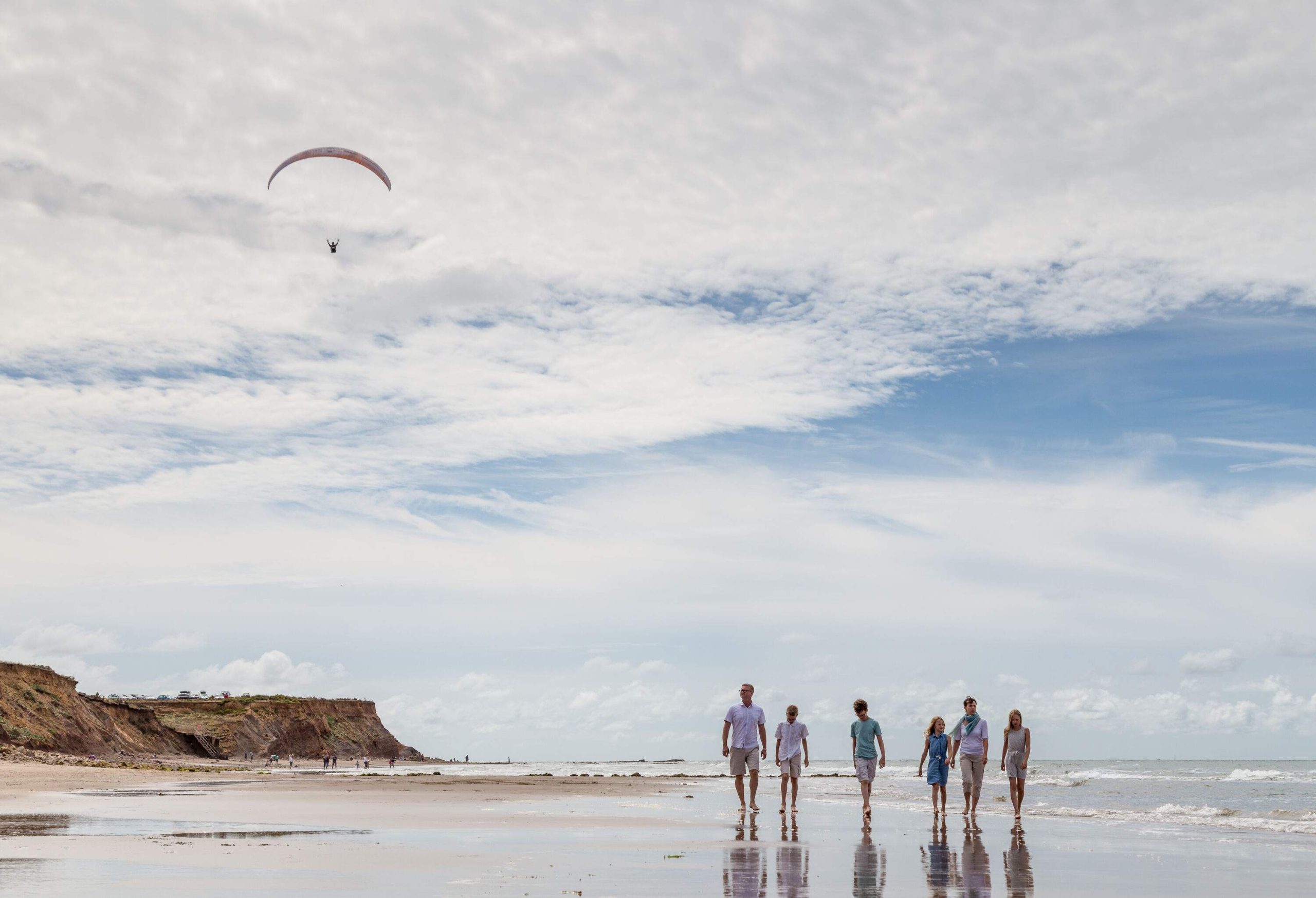 Candid moments from a family walk along the beach on a summers day on the Isle of Wight