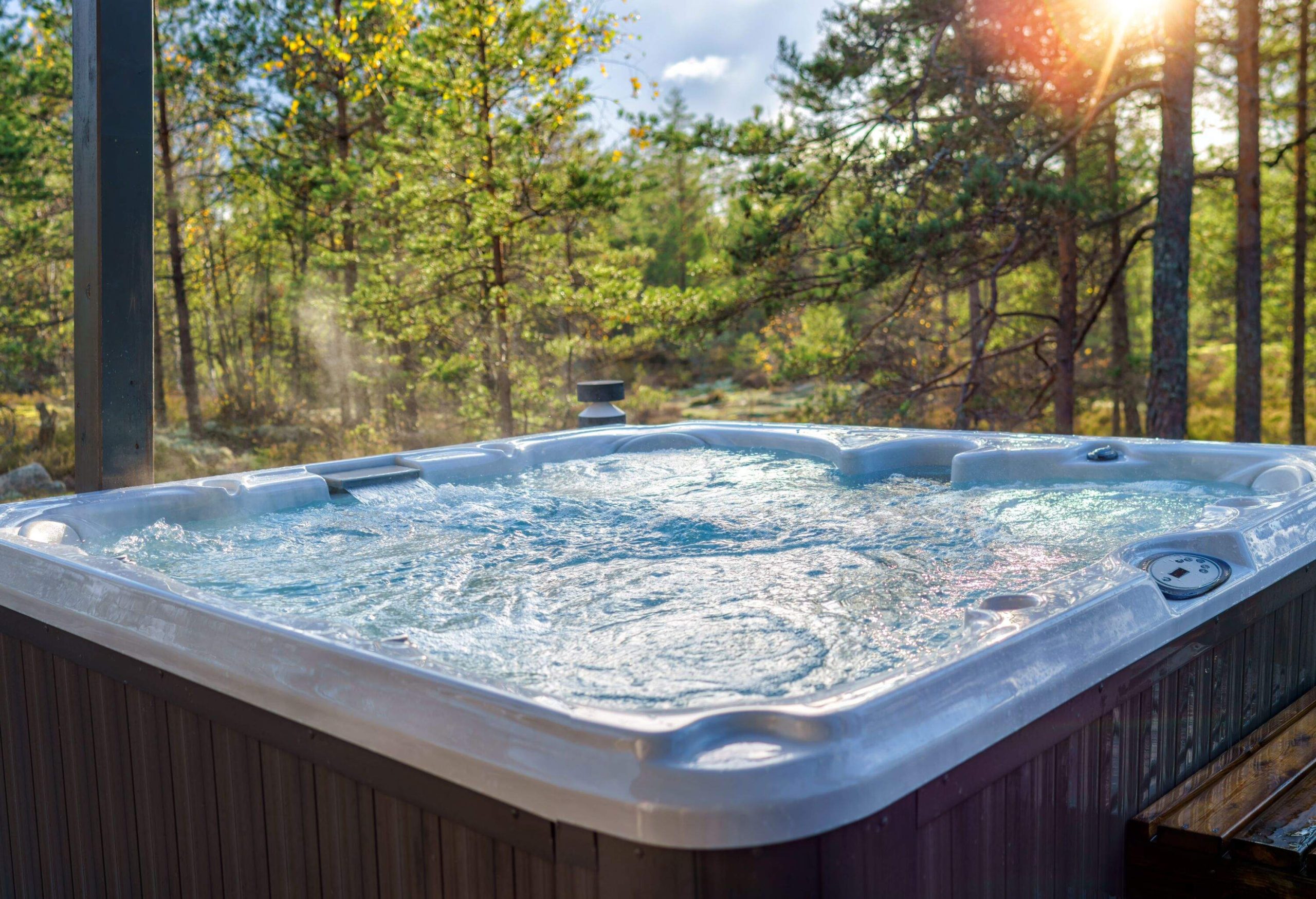 A warm hot tub in a beautiful forest landscape at sunset. You can relax outdoors in nature while enjoying the warmth of the hot tub.