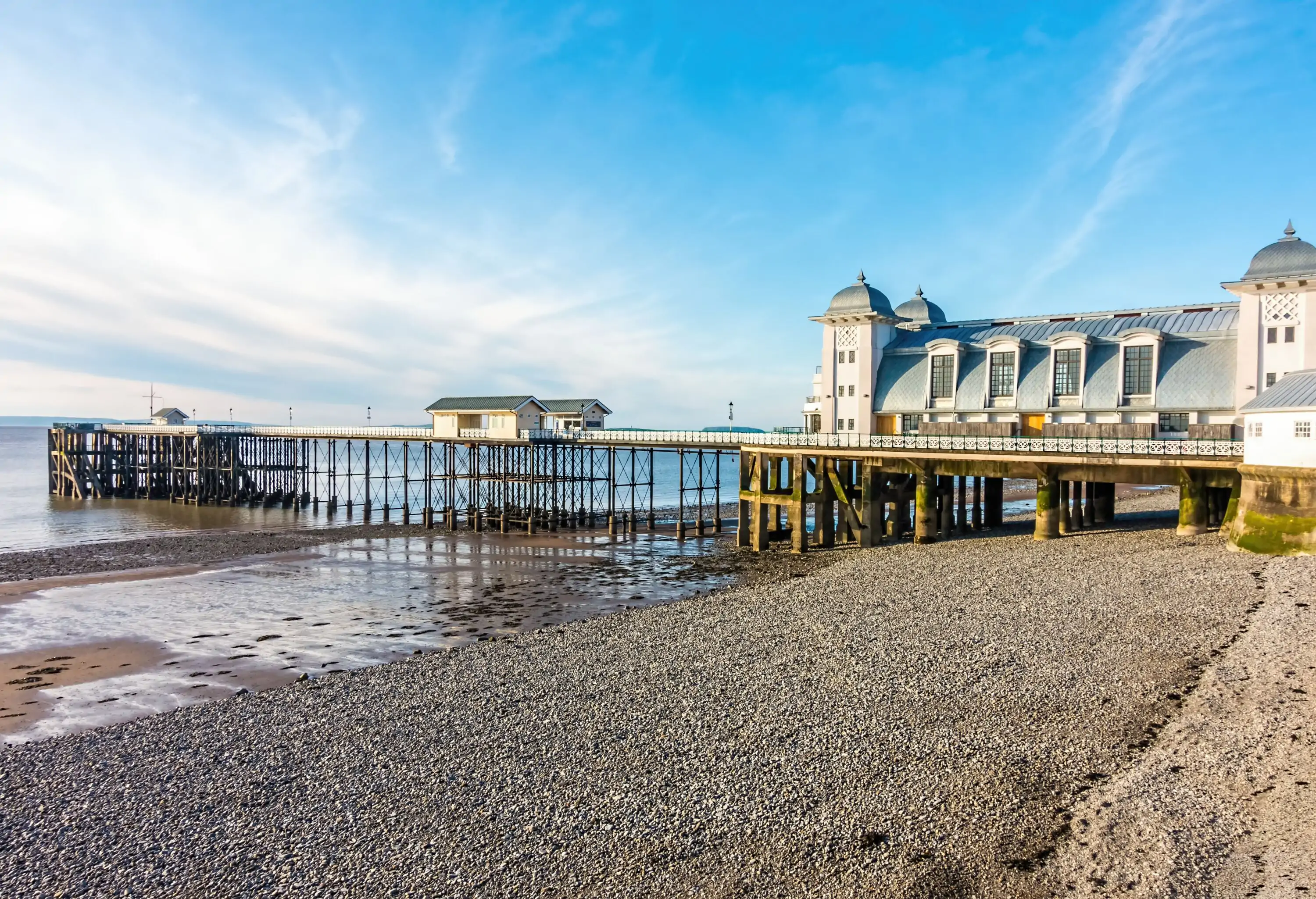 View of Penarth Pier and pebble beach in summer on a sunny day