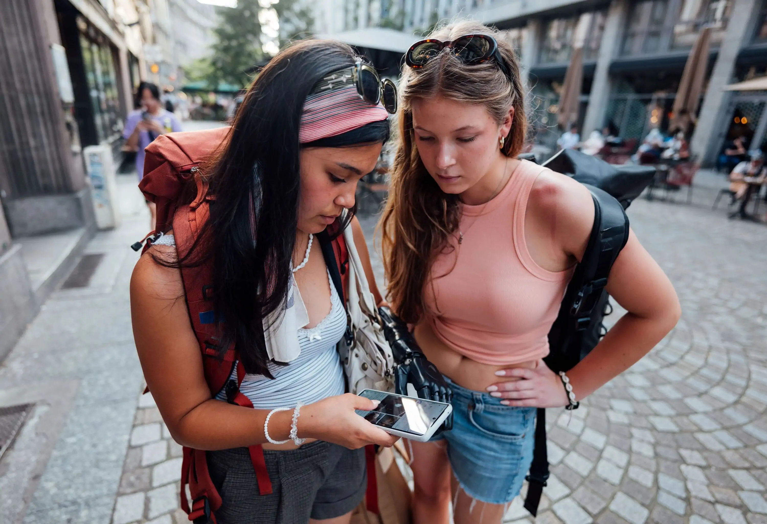 Two young women traveling on backpacking Interrail trip through Europe, arriving and spending time in France.