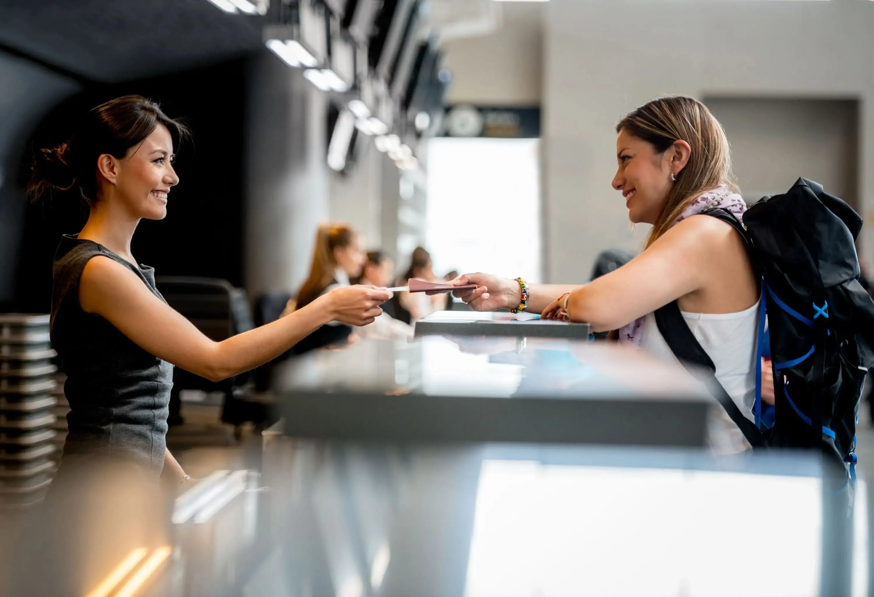 Traveling woman at the airport doing check-in