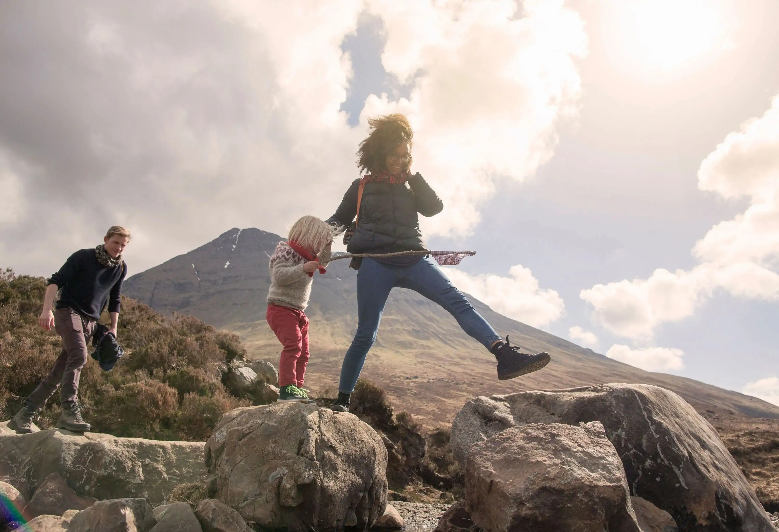 Family hiking on mountainous terrain