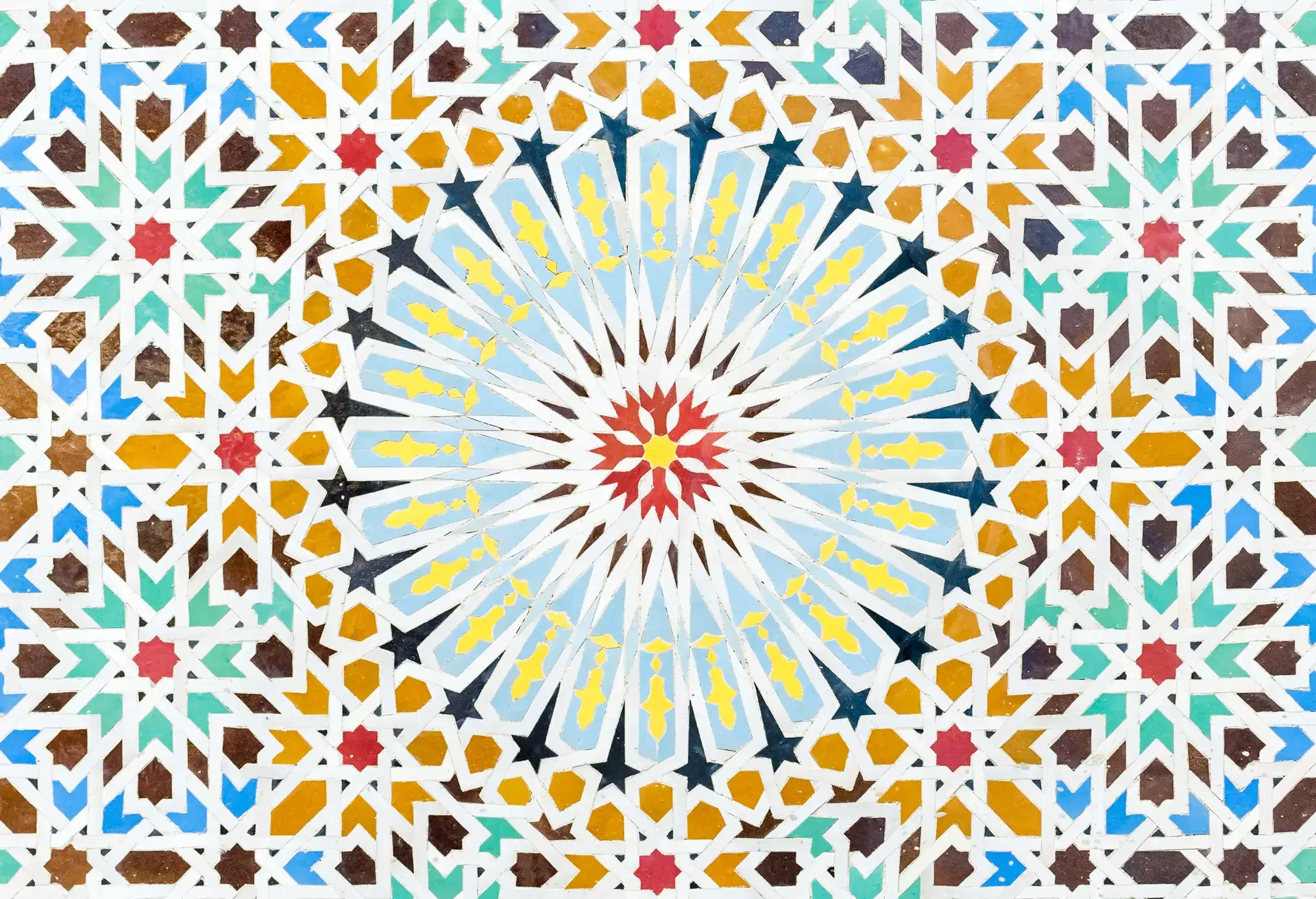 Zelige multi-coloured geometric mosaic of tiles in a typical arabic style. Found on the walls of a fountain at a mosque in the United Arab Emirates