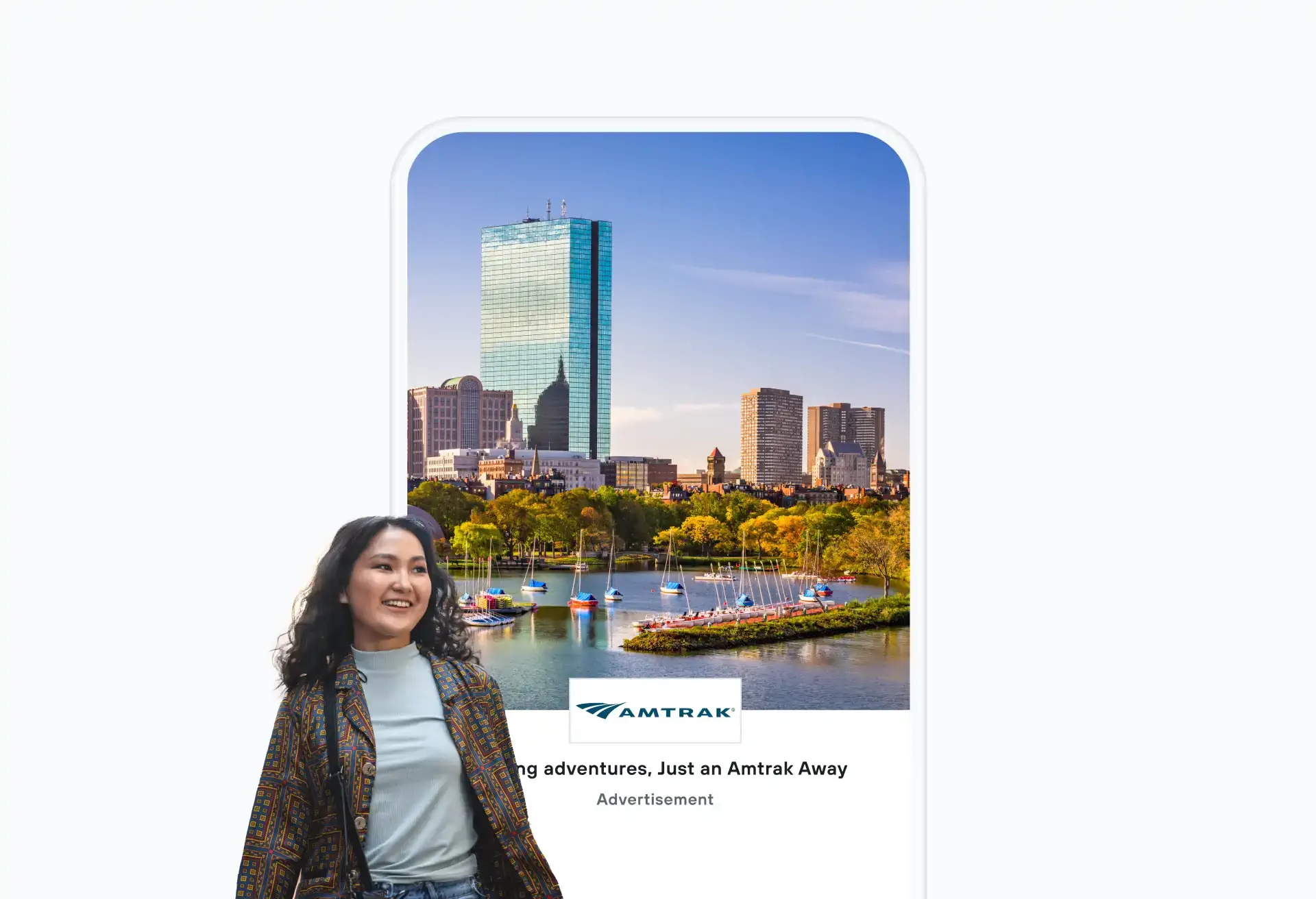 Amtrak mobile ad featuring a smiling traveler and a scenic city skyline view.