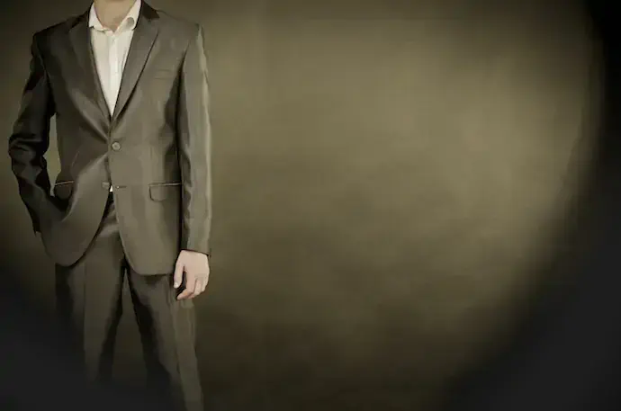 man in suit on a black background