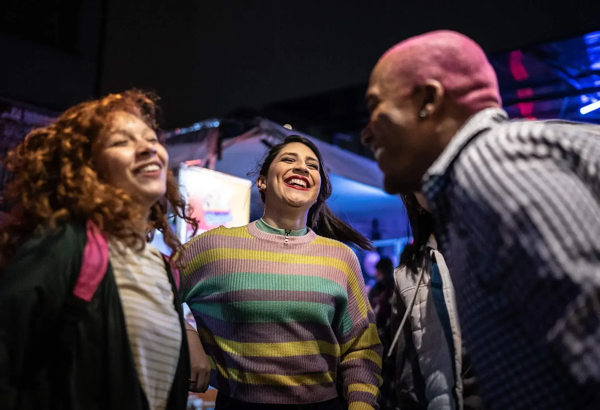 Friends having fun at nightclub - including a transgender person