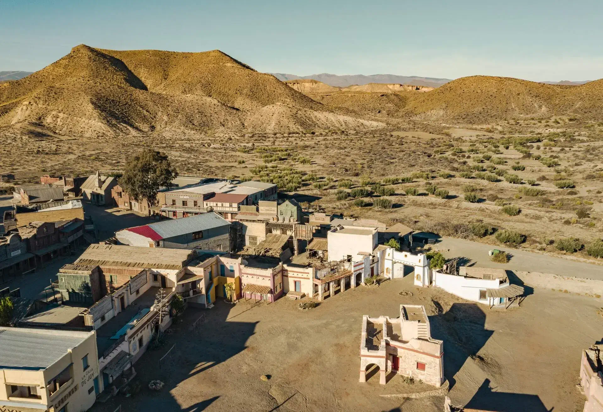 Drone above view of Tabernas Desert Landscape Texas Hollywood Fort Bravo the western style theme park in Almeria Andalusia Spain Europe