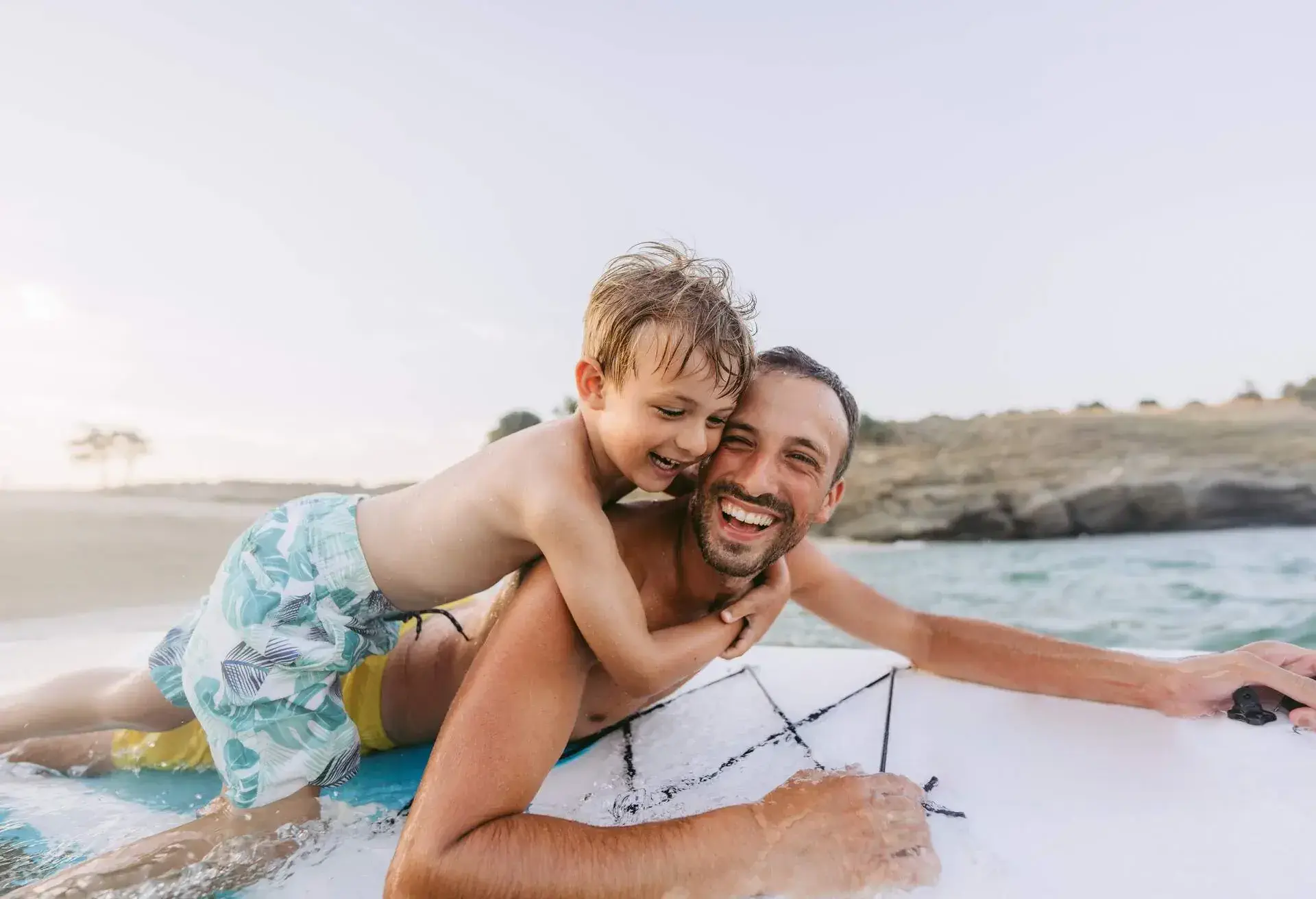 DEST_GREECE_THEME_PEOPLE_MAN_KID_BOY_SURFING_PADDLEBOARD_GettyImages