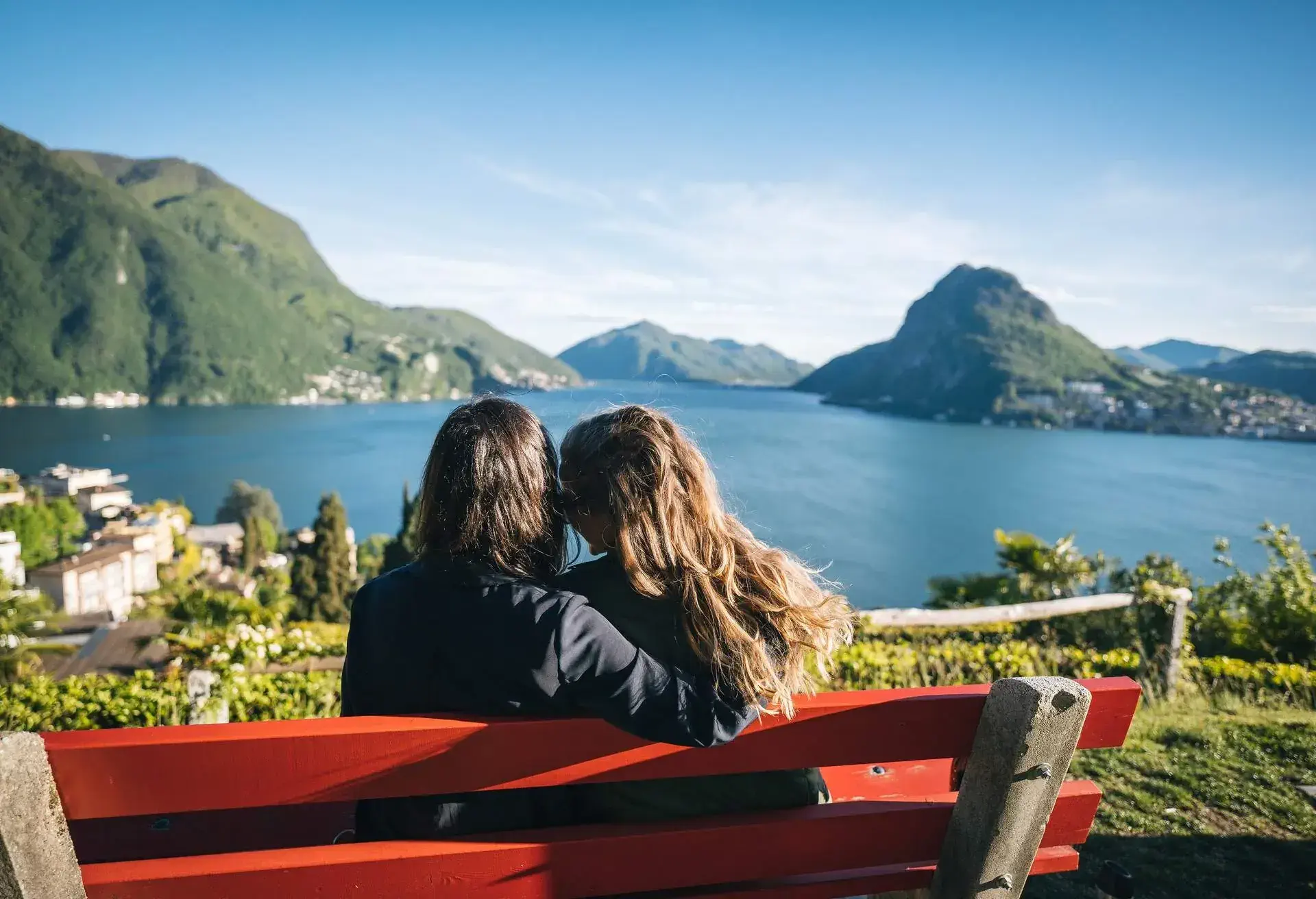 DEST_SWITZERLAND_LAKE_LUGANO_PEOPLE_WOMEN_BENCH_GettyImages