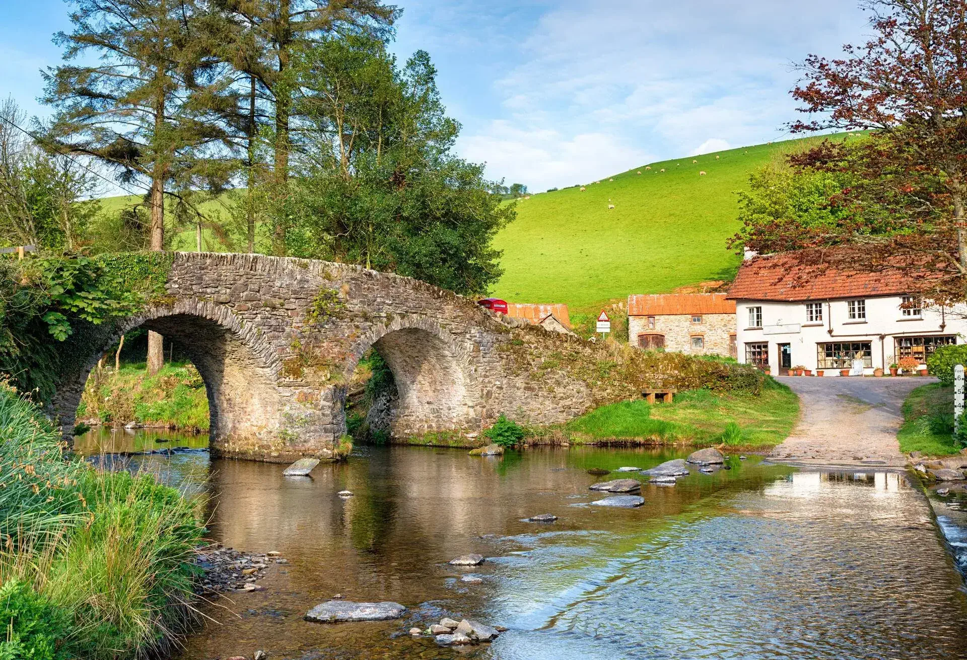 The bridge and ford at Malmsmead in the Doone Valley directly on the border between Somerset and Devon and on Exmoor National Park; Shutterstock ID 422568634