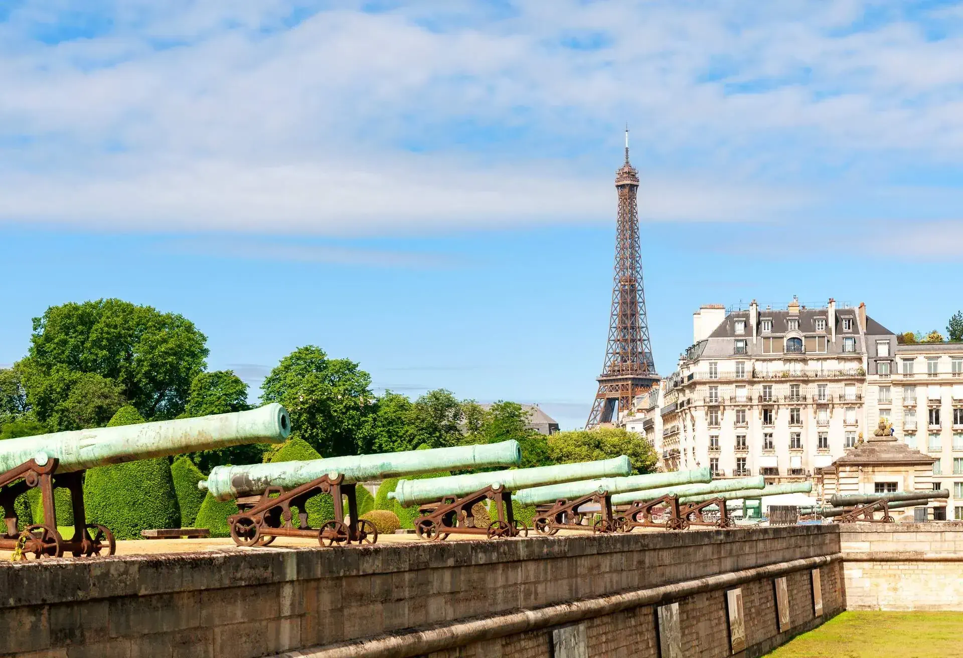 View on Eiffel tower with Les Invalides canons in foreground. Paris