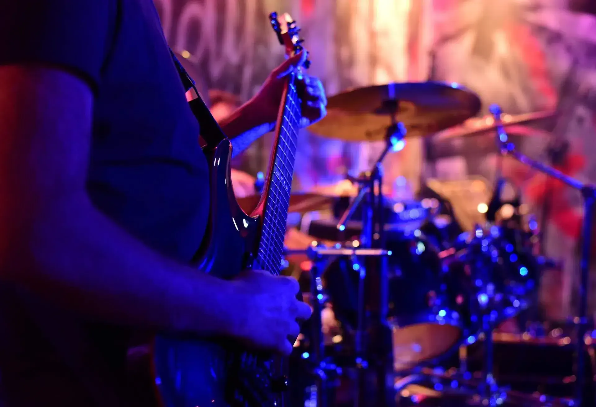 Drummer and Guitarist during a live music concert