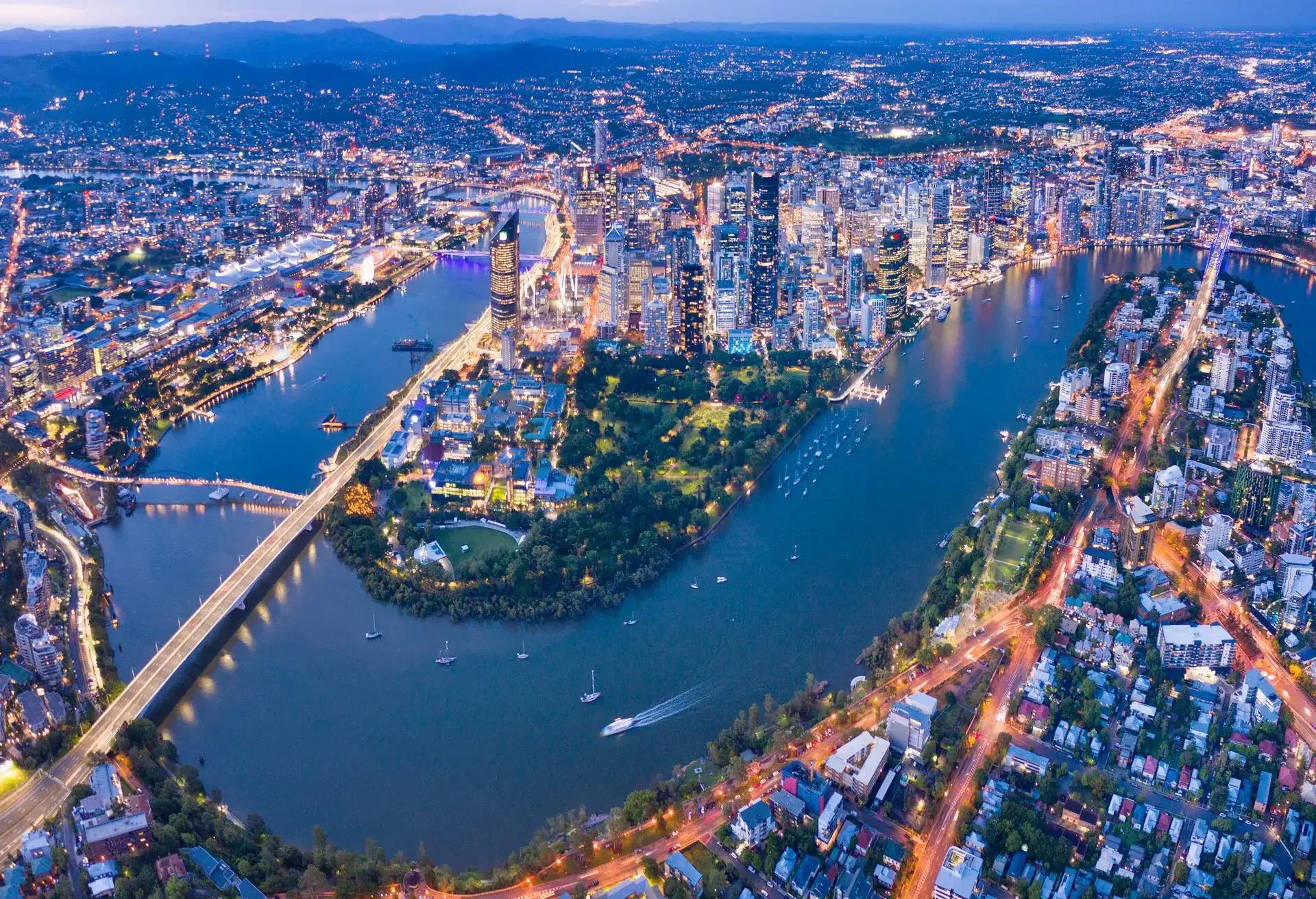 Brisbane Skyline Night Panorama with the famous illuminated Story Bridge, Botanical Garden and Whell, Queensland, Australia. Converted from RAW.