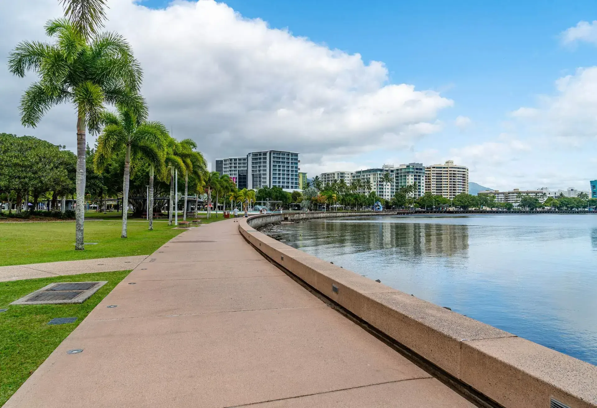 View of Cairns Esplanade Lagoon, a large free public pool next to the beach in Cairns, Queensland, Australia.