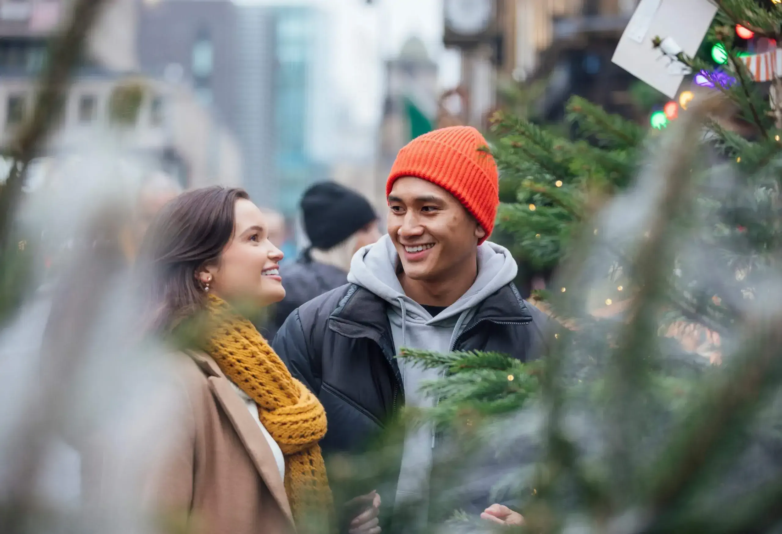 In the heart of Newcastle upon Tyne's Christmas market, a couple's joy shines as they select their very first Christmas tree together. Amidst the twinkling lights and festive charm, their laughter and shared excitement create a magical moment filled with the promise of new traditions and cherished memories.