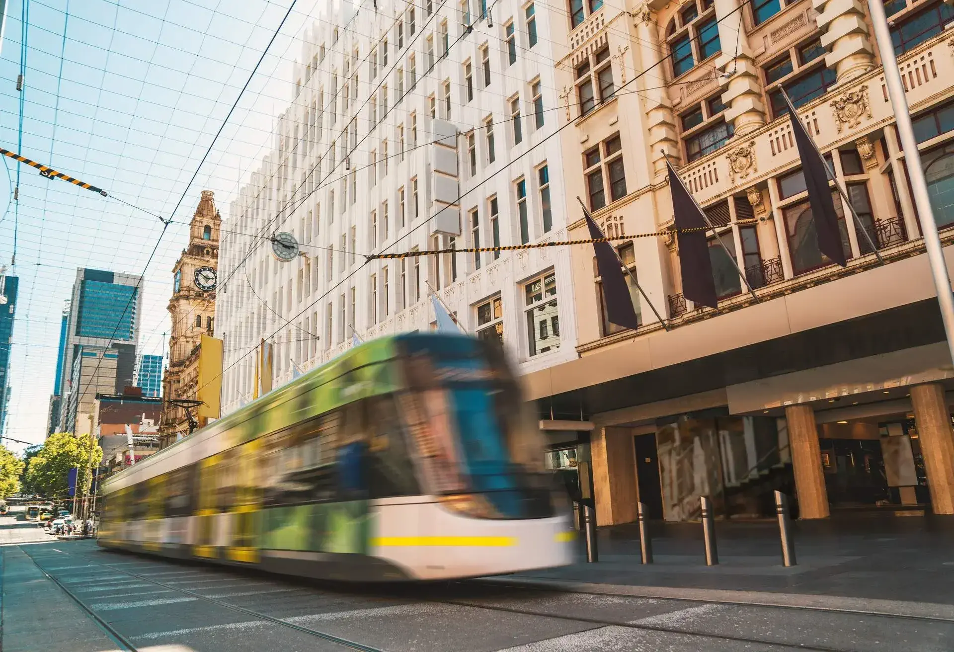 Bourke St Mall with tram passing through frame.
