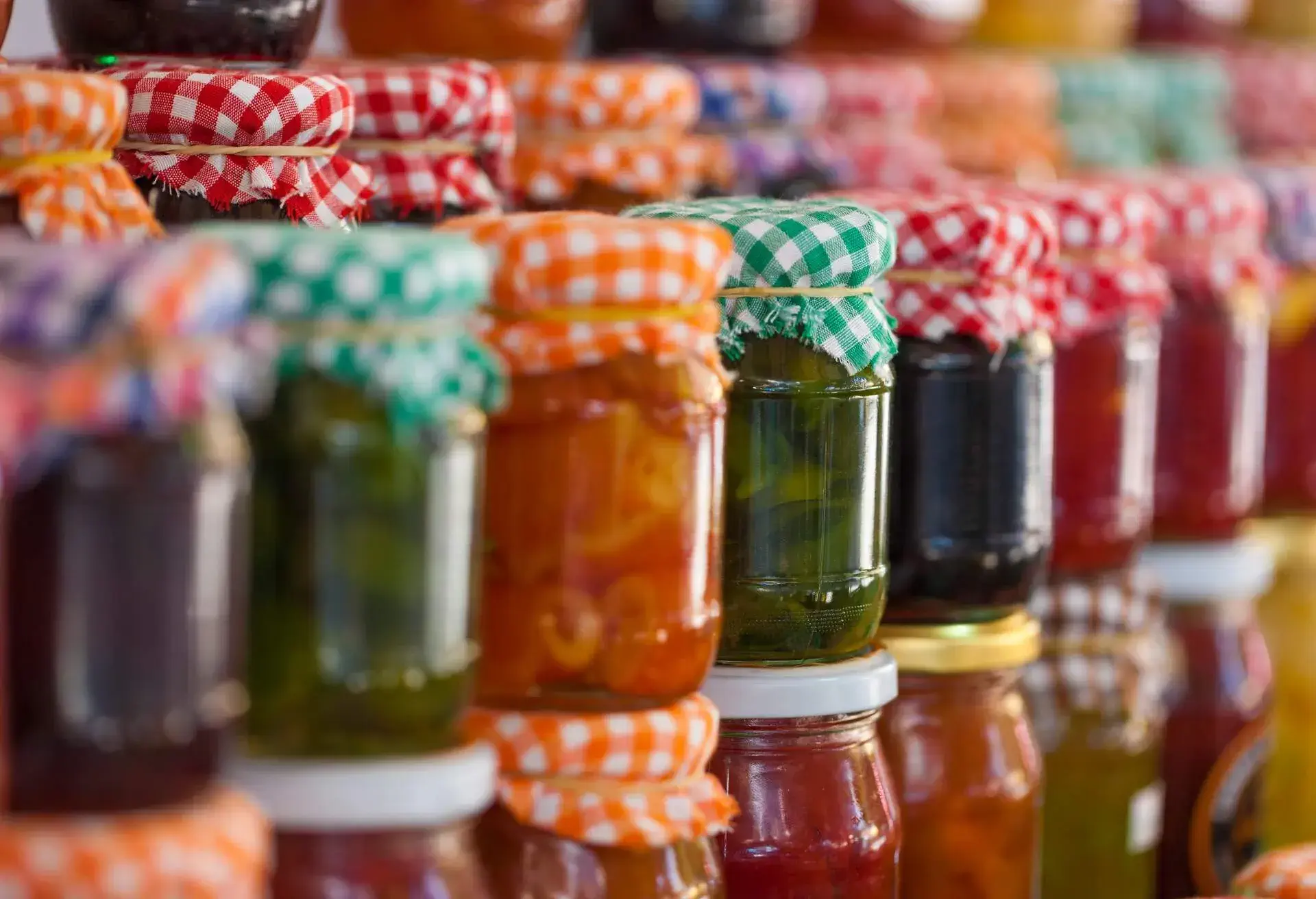 Glass jars of homemade jam and marmalade for sale