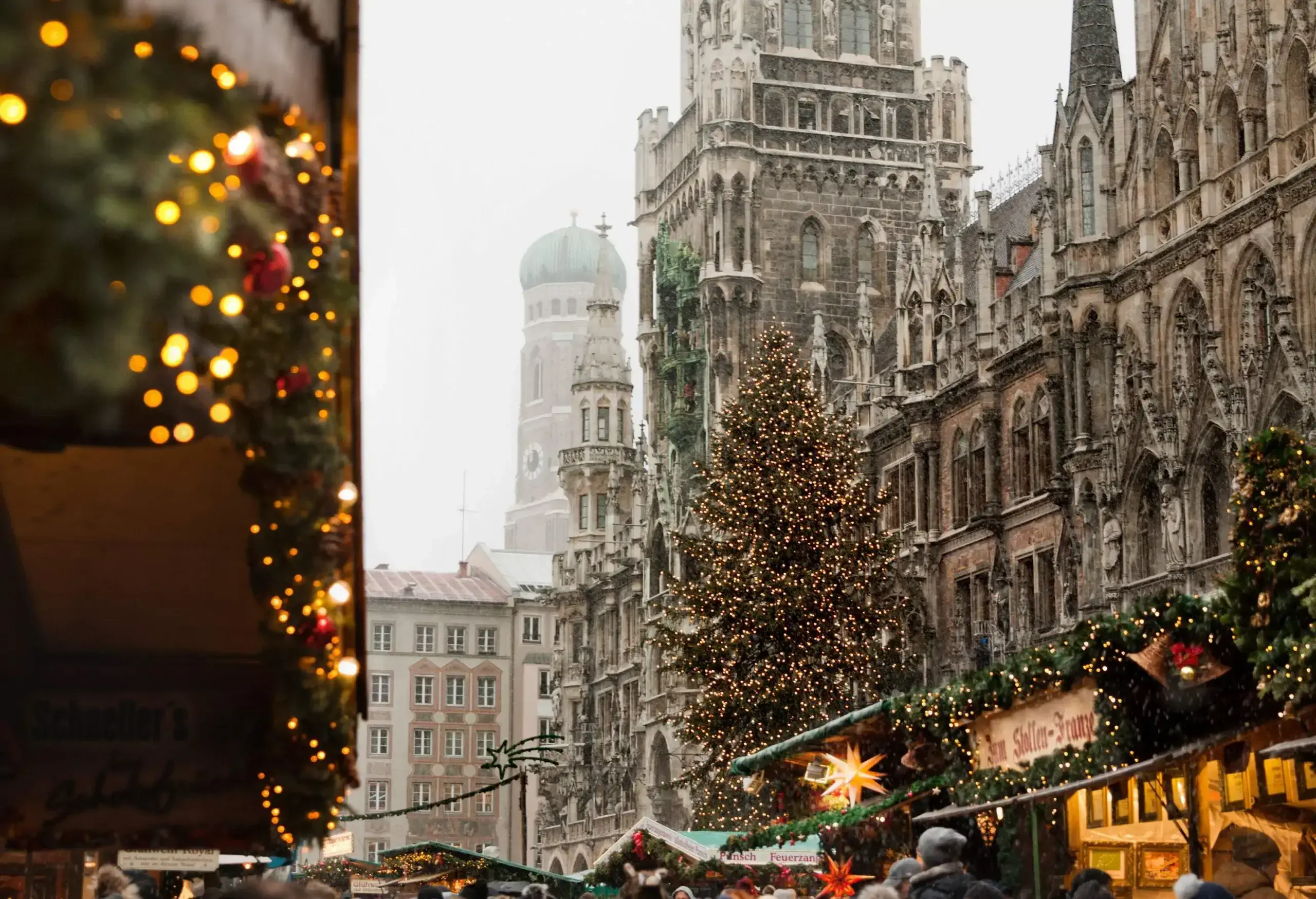 Facade of Munich's New Town Hall with neo-gothic architecture in front of the Christmas Market.
