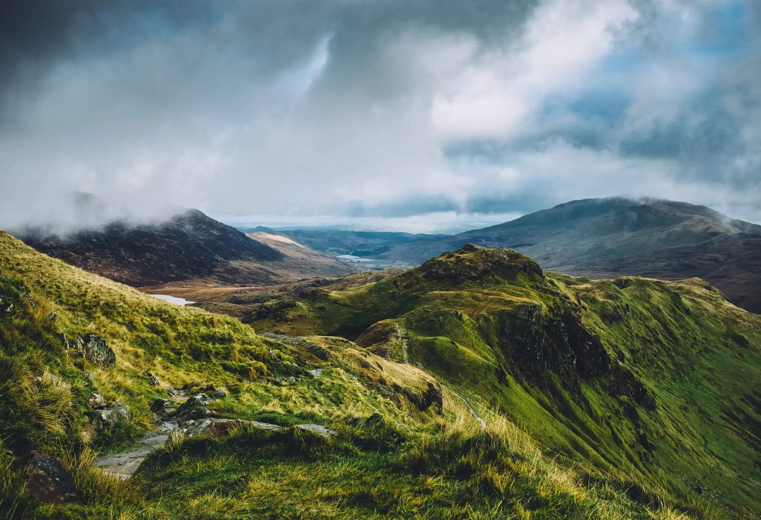 Looking down at Snowdonia national park from the start of the Crib Goch ridge on Mount Snowdon in Wales on a beautiful Autumn day.
