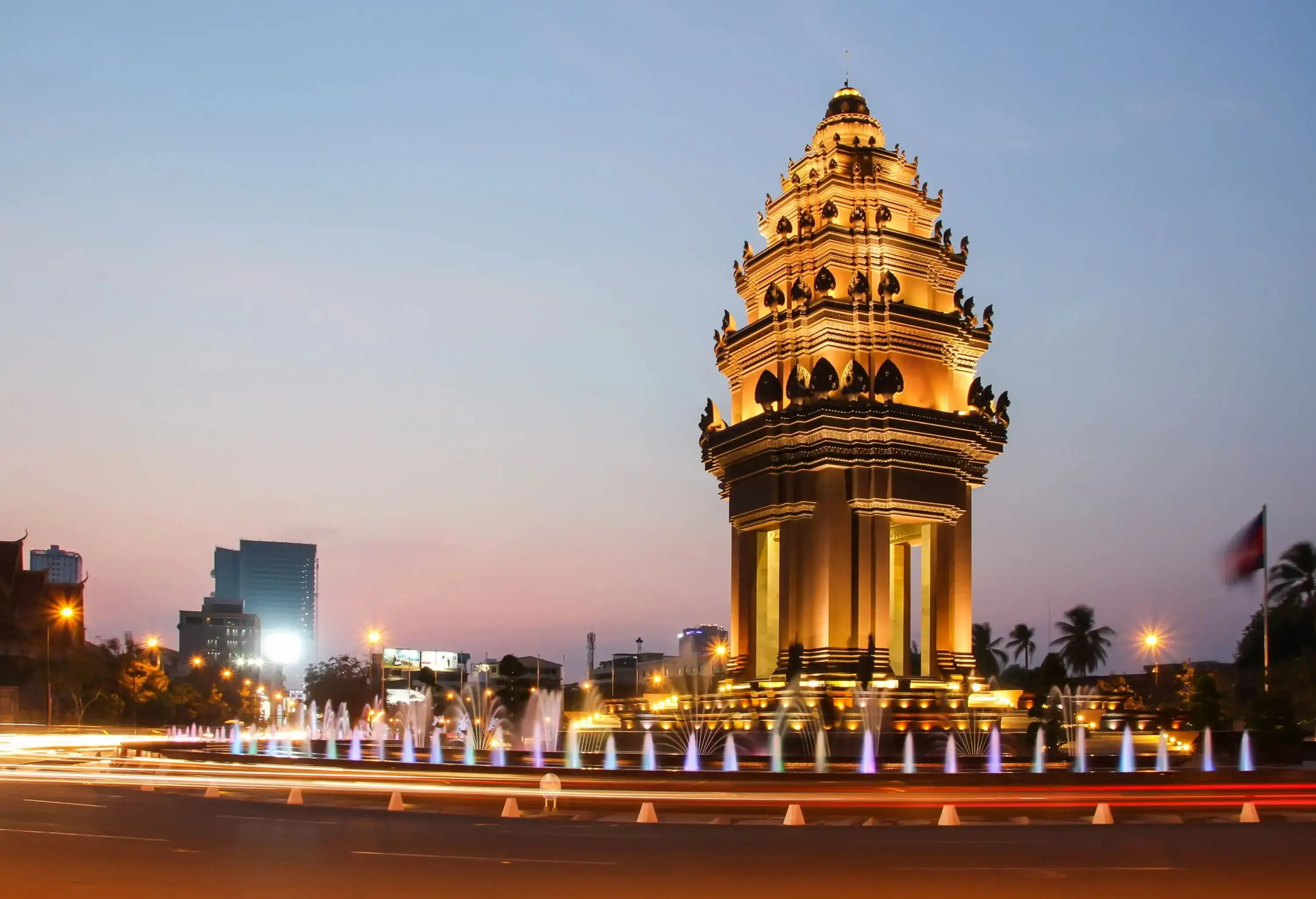 The majestic Independence Monument in Phnom Penh stands proudly, surrounded by captivating fountains that enhance its grandeur.