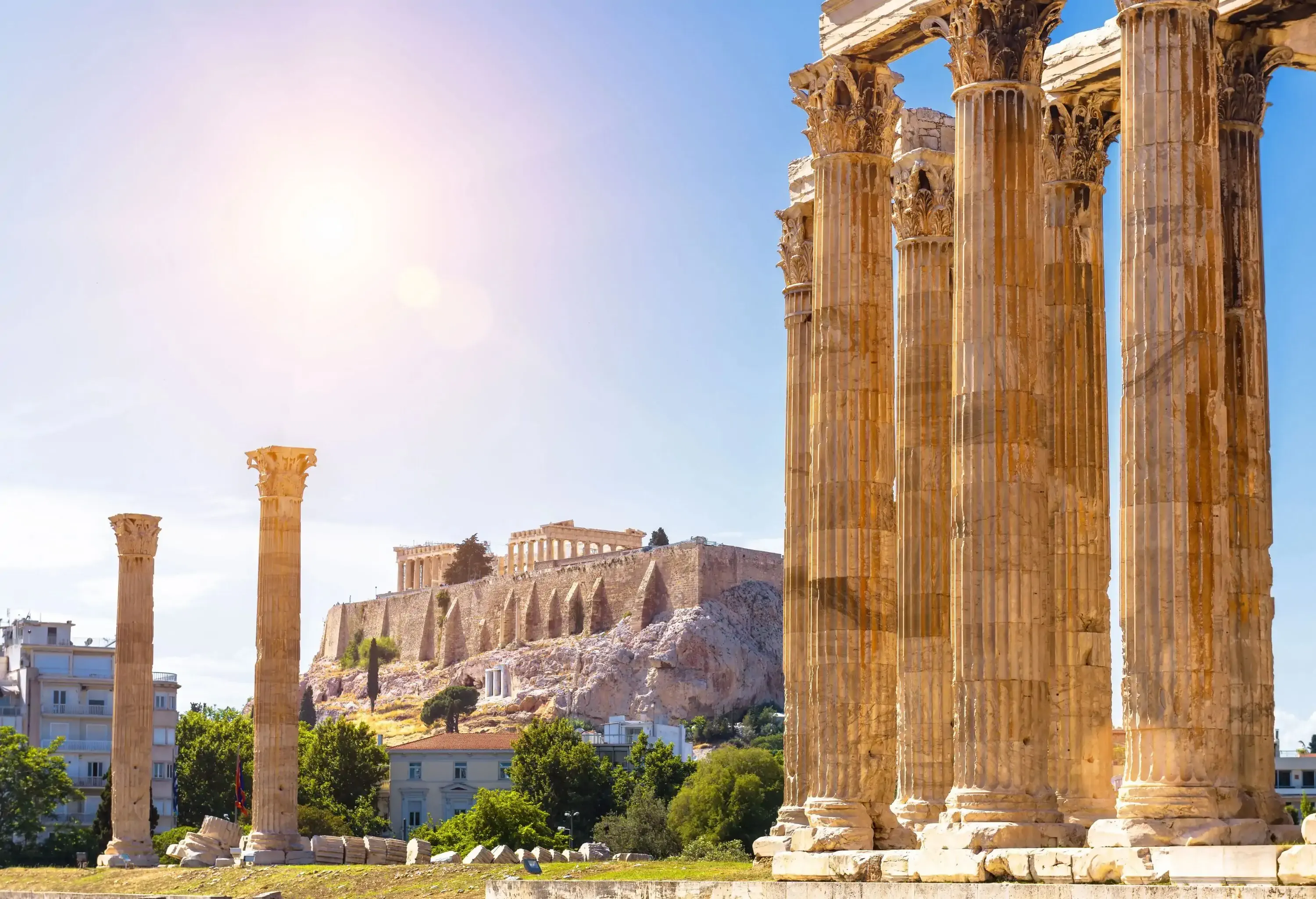 The tall pillars of the ruins of Zeus's temples overlooking the Acropolis in Athens, Greece.