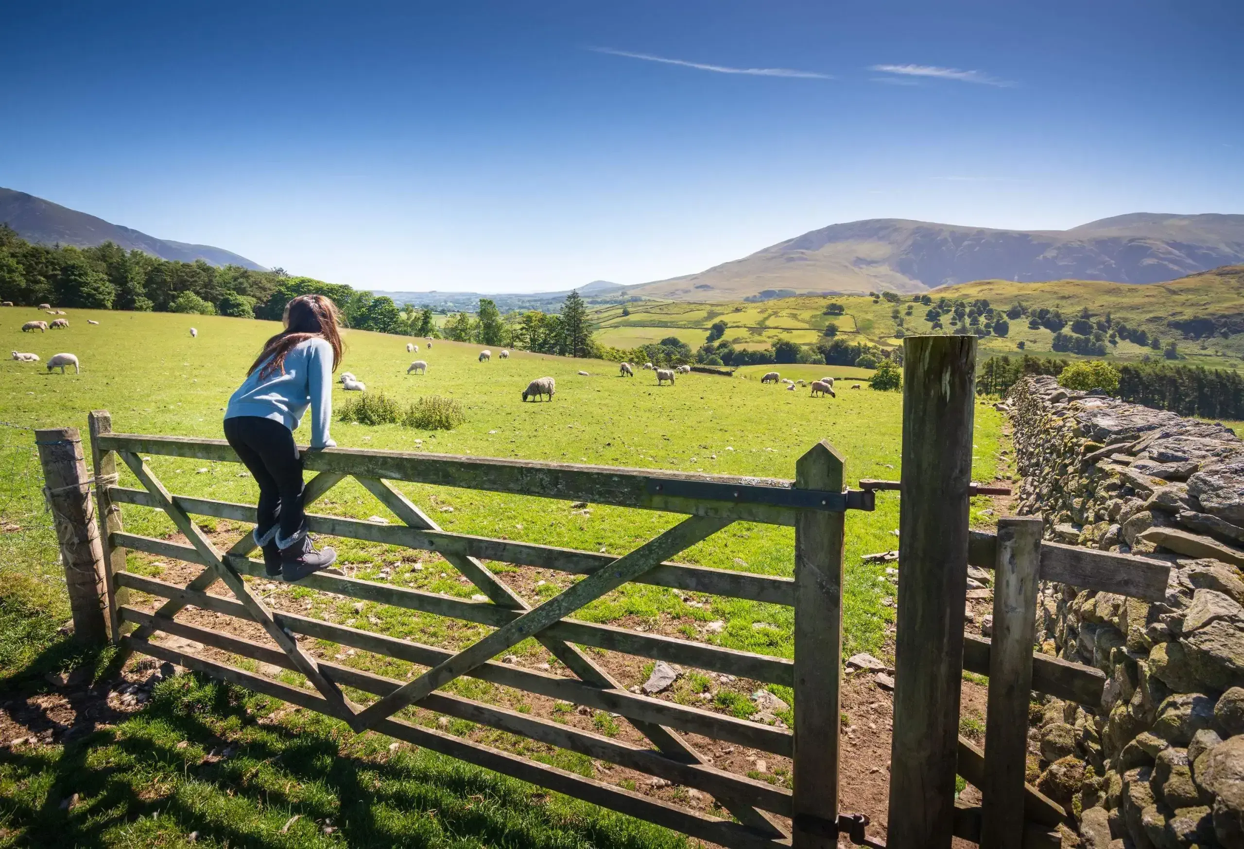 Keswick is a beautiful town located in the English Lake District, where the lush green hills meet the tranquil lake of Derwentwater. Shot in Summer.