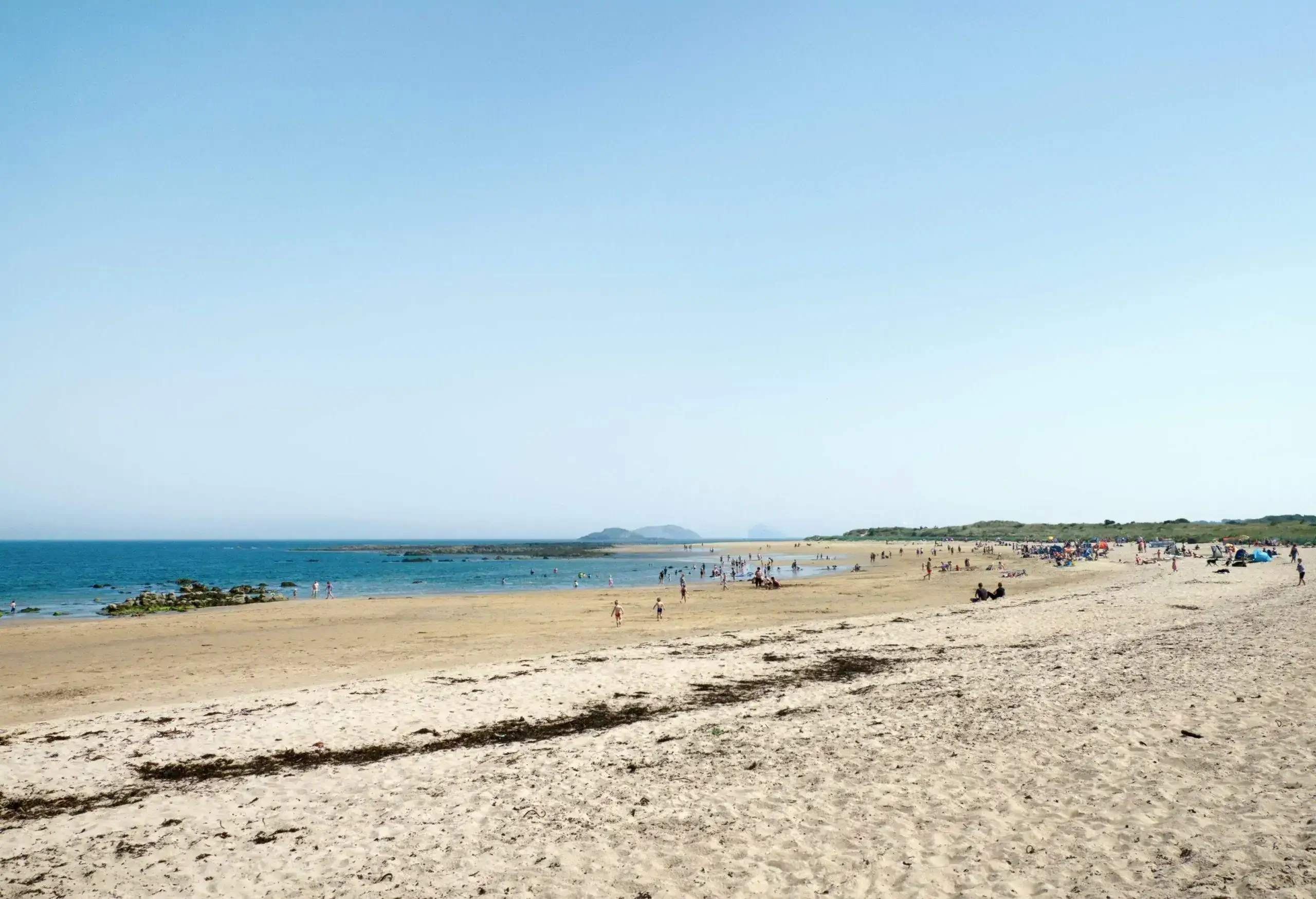 People relax on the beach.