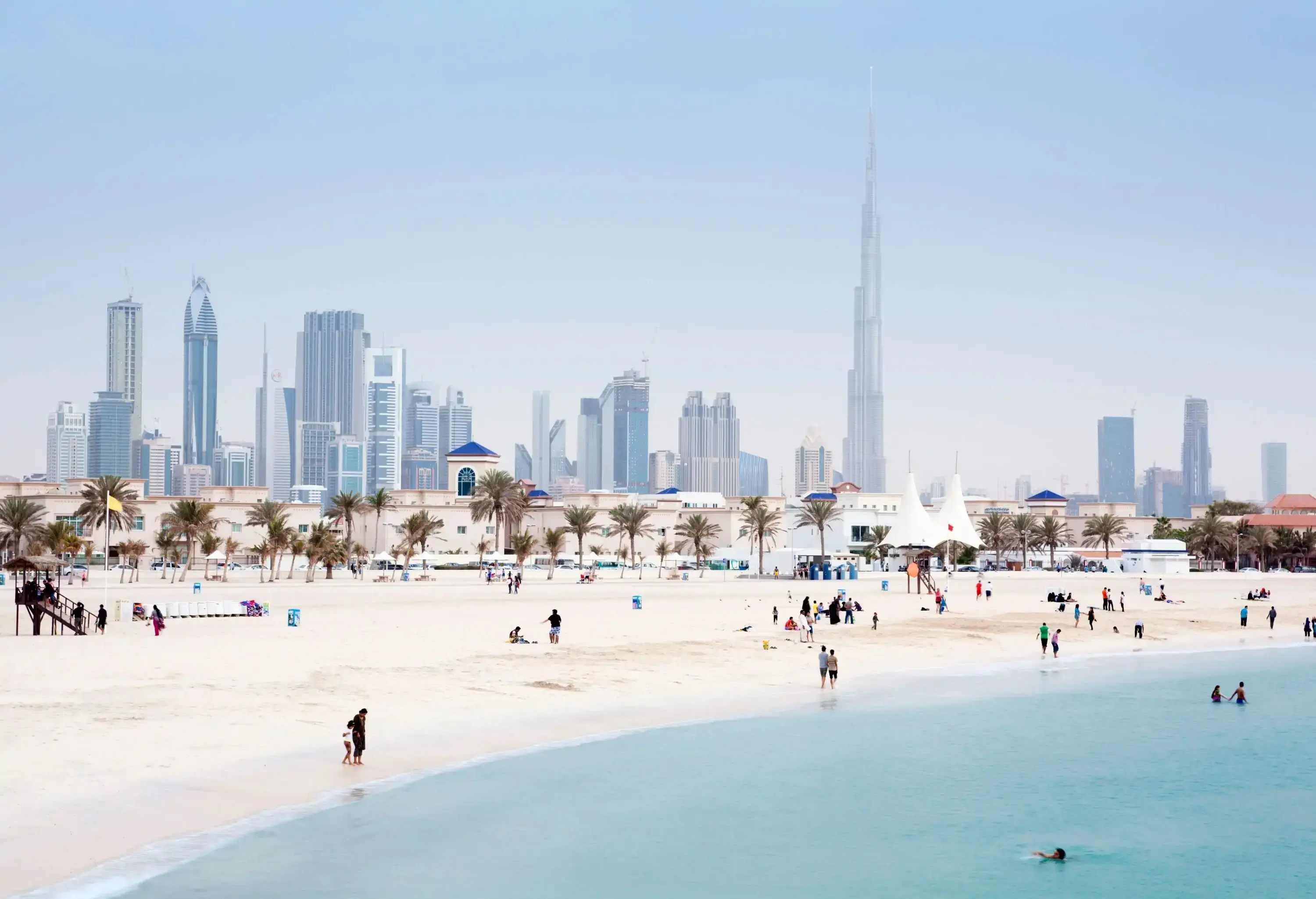 The crowded Jumeirah Beach backed by Dubai's distinctive architecture.