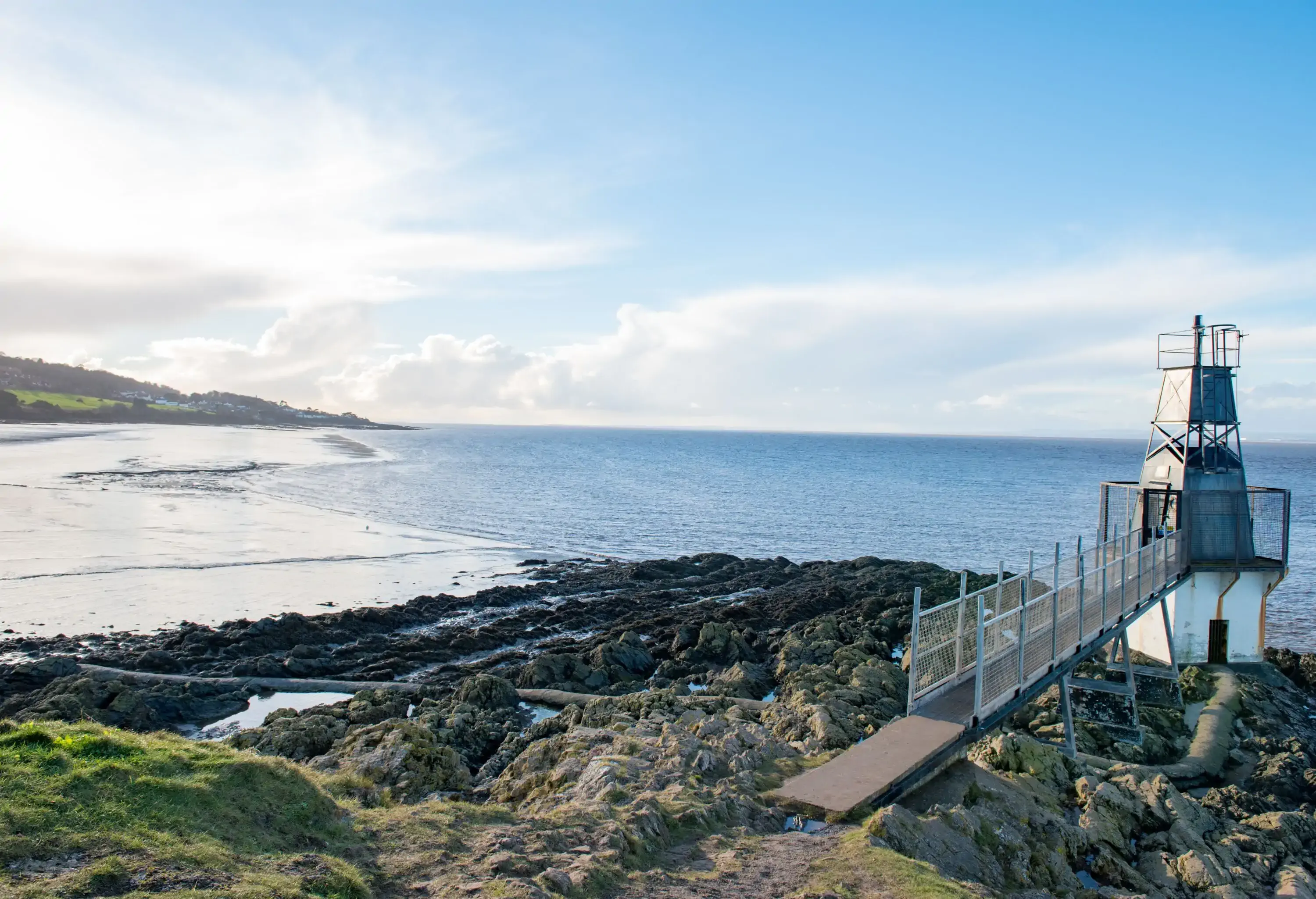 Daytime view of lighthouse and beach at Battery Point, Portishead lighthouse and beach at Battery Point